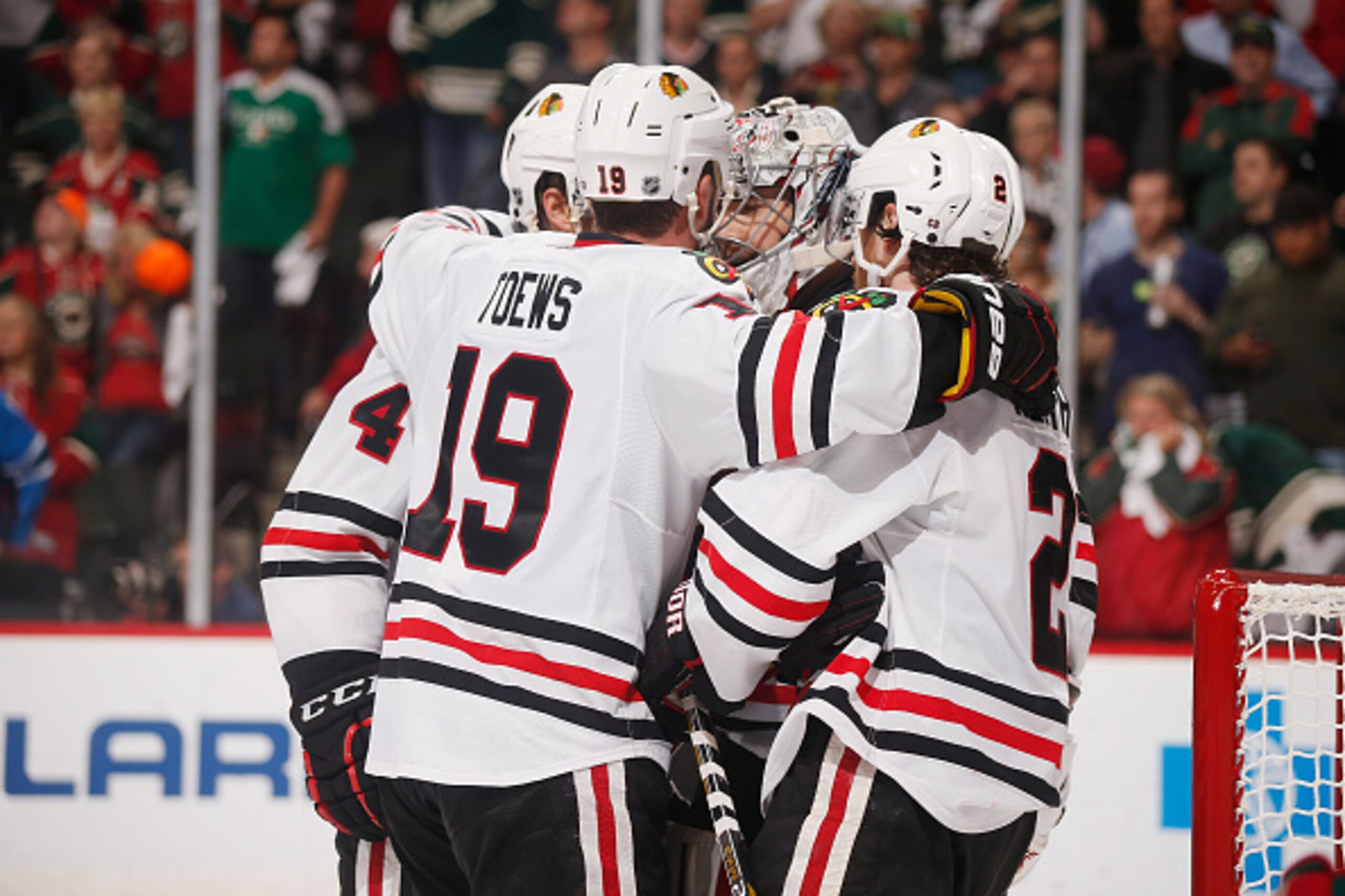 ST. PAUL, MN - MAY 7: (L-R) Niklas Hjalmarsson #4, Jonathan Toews #19, Corey Crawford #50, and Duncan Keith #2 of the Chicago Blackhawks celebrate after eliminating the Minnesota Wild in Game Four of the Western Conference Semifinals during the 2015 NHL S