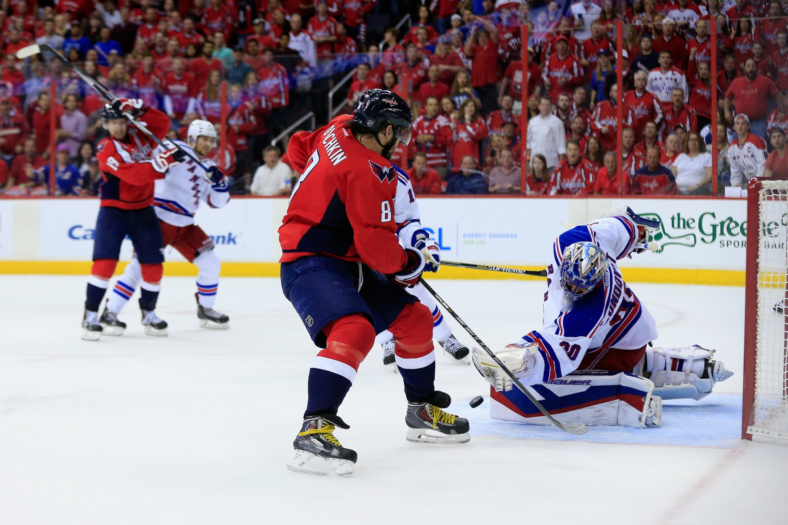 WASHINGTON, DC - MAY 10: Goalie Henrik Lundqvist #30 of the New York Rangers blocks a shot by Alex Ovechkin #8 of the Washington Capitals during the third period of the Rangers 4-3 win during Game Six of the Eastern Conference Semifinals during the 2015 N