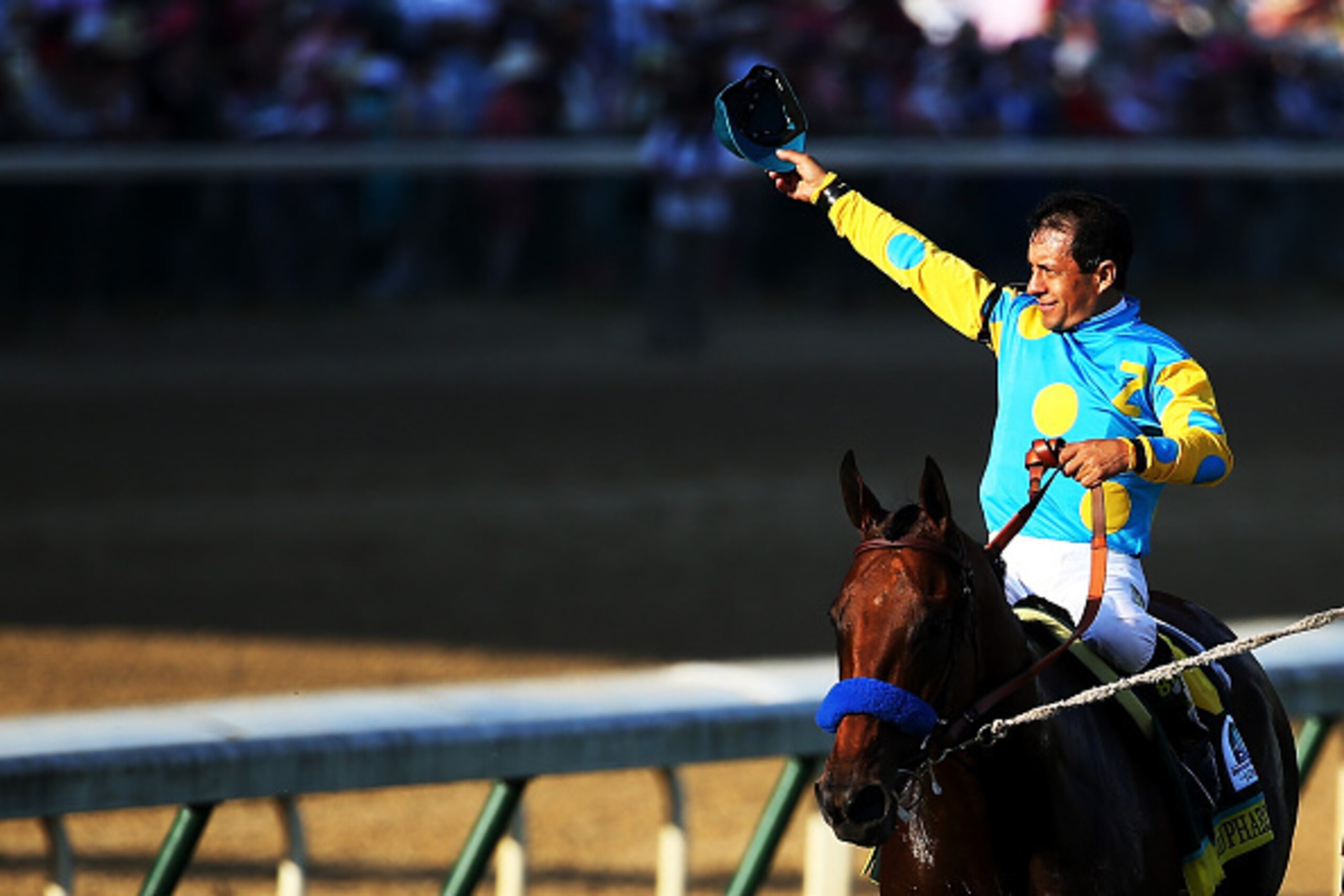 LOUISVILLE, KY - MAY 02:  Jockey Victor Espinoza celebrates atop of American Pharoah #18 on his way to winners circle after winning the 141st running of the Kentucky Derby at Churchill Downs on May 2, 2015 in Louisville, Kentucky.  (Photo by Andy Lyons/Ge