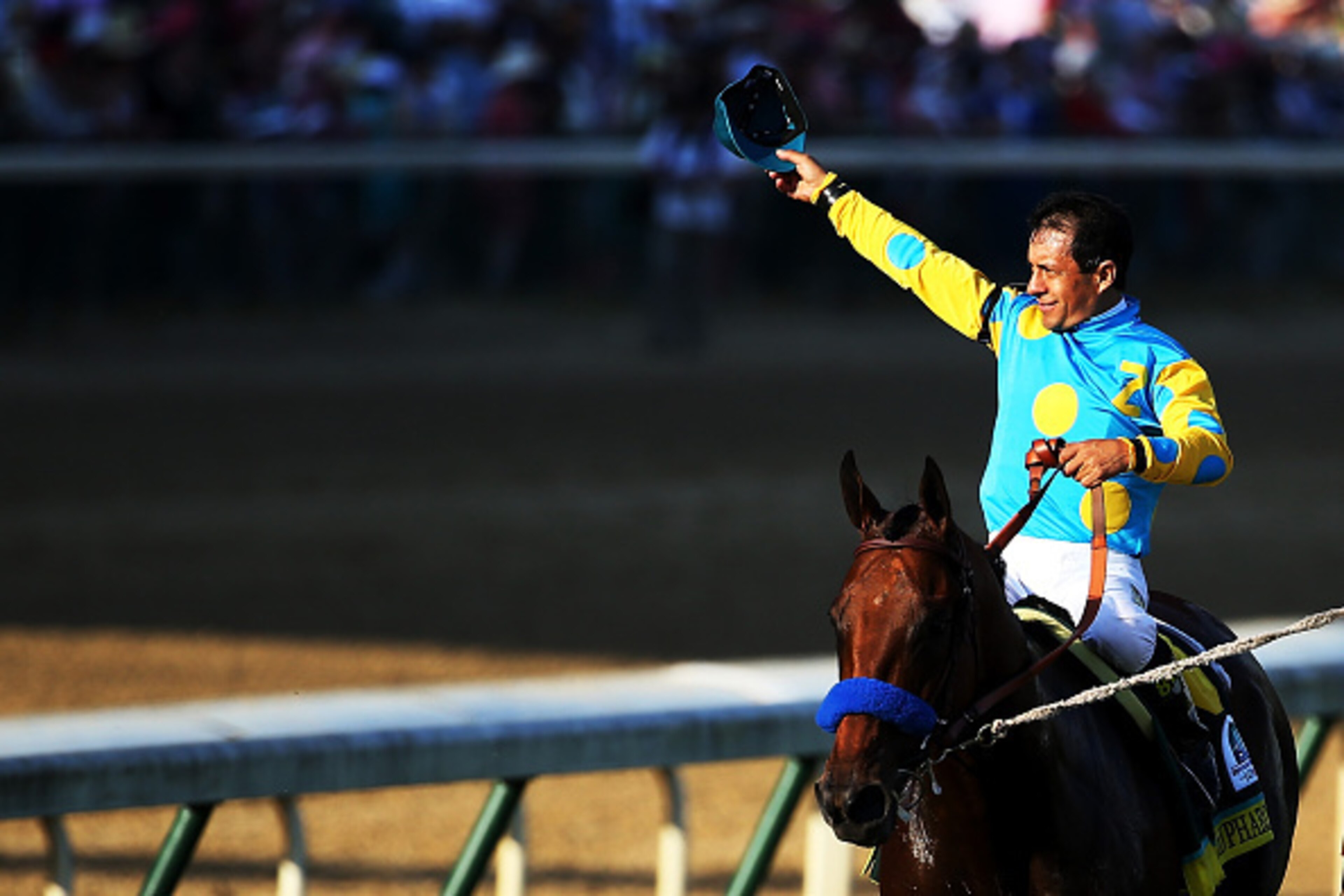 LOUISVILLE, KY - MAY 02:  Jockey Victor Espinoza celebrates atop of American Pharoah #18 on his way to winners circle after winning the 141st running of the Kentucky Derby at Churchill Downs on May 2, 2015 in Louisville, Kentucky.  (Photo by Andy Lyons/Ge