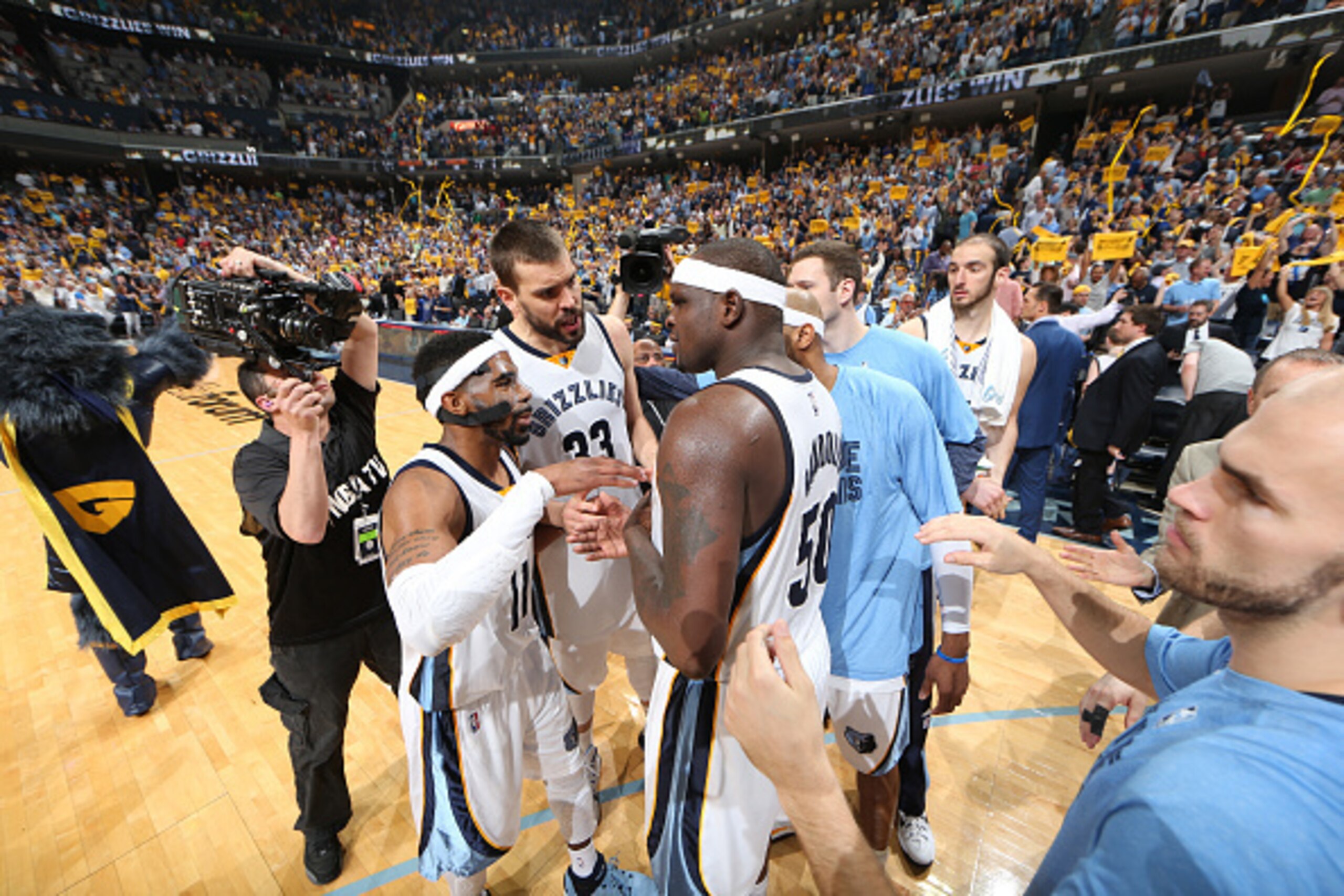 MEMPHIS, TN - MAY 9: Mike Conley #11, Marc Gasol #33 and Zach Randolph #50 of the Memphis Grizzlies huddle after the win against the Golden State Warriors for Game Three of the Western Conference Semifinals during the NBA Playoffs on May 9, 2015 at FedExF