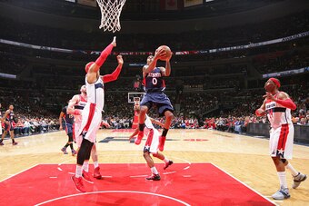 WASHINGTON, DC - MAY 11: Jeff Teague #0 of the Atlanta Hawks shoots against Drew Gooden #90 and Paul Pierce #34 of the Washington Wizards in Game Four of the Eastern Conference semifinals during the 2015 NBA Playoffs on May 11, 2015 at Verizon Center in W