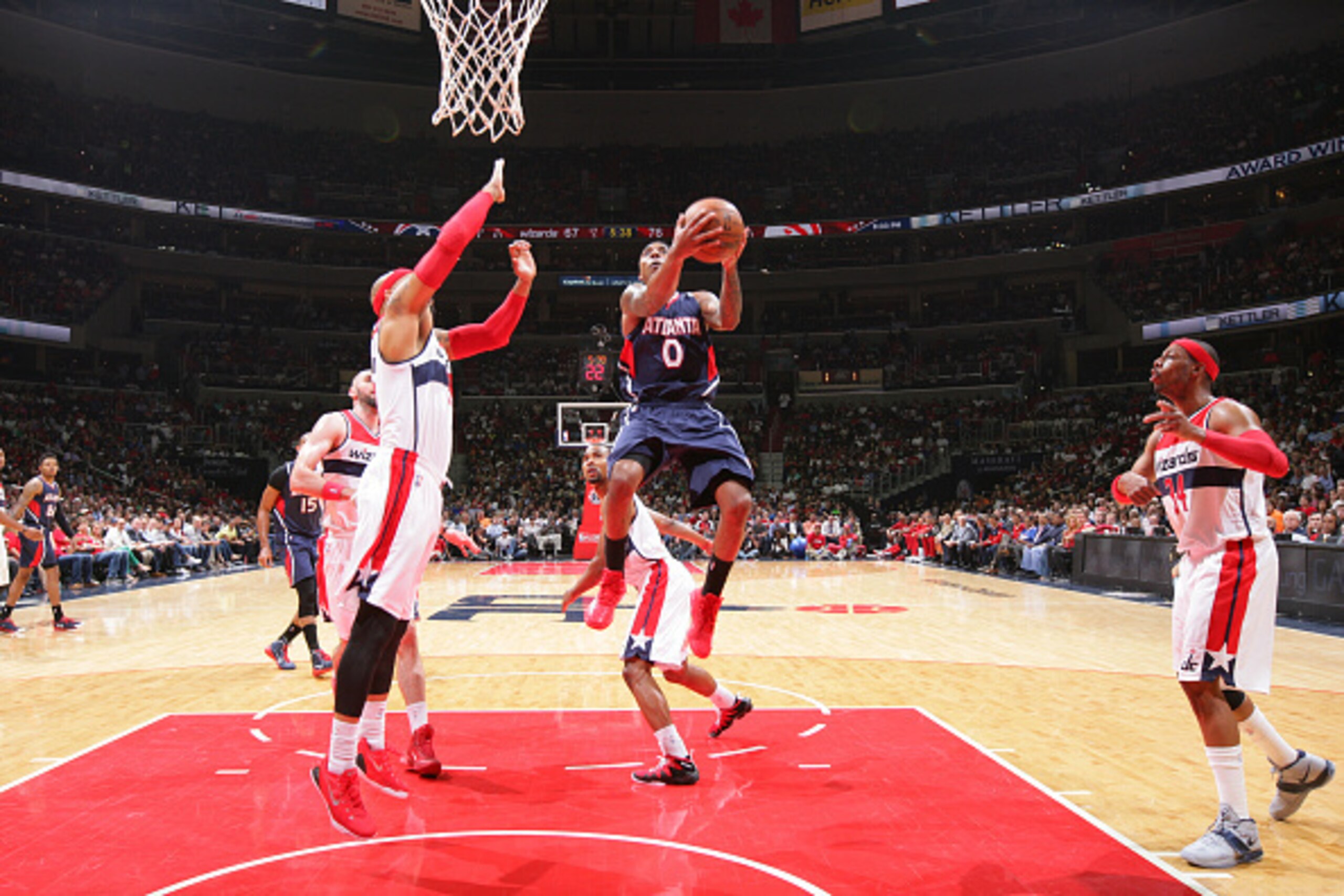 WASHINGTON, DC - MAY 11: Jeff Teague #0 of the Atlanta Hawks shoots against Drew Gooden #90 and Paul Pierce #34 of the Washington Wizards in Game Four of the Eastern Conference semifinals during the 2015 NBA Playoffs on May 11, 2015 at Verizon Center in W WASHINGTON, DC - MAY 11: Jeff Teague #0 of the Atlanta Hawks shoots against Drew Gooden #90 and Paul Pierce #34 of the Washington Wizards in Game Four of the Eastern Conference semifinals during the 2015 NBA Playoffs on May 11, 2015 at Verizon Center in W