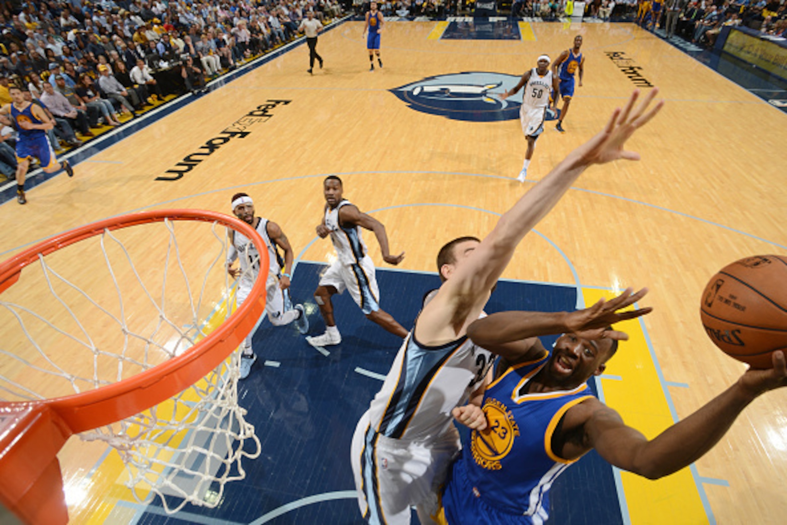MEMPHIS, TENNESSEE - MAY 11: Draymond Green #23 of the Golden State Warriors shoots against the Memphis Grizzlies during Game Four of the Western Conference Semifinals for the NBA Playoffs on May 11, 2015 at FedExForum in Memphis, Tennessee.  NOTE TO USER
