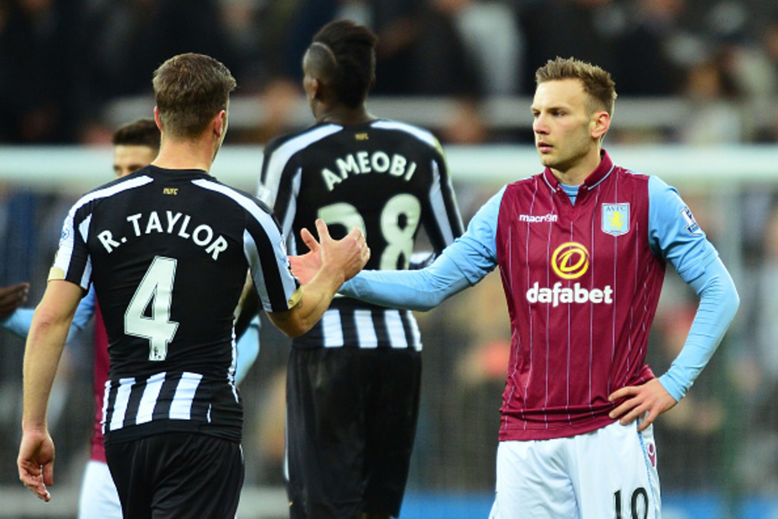 NEWCASTLE UPON TYNE, ENGLAND - FEBRUARY 28:  Ryan Taylor of Newcastle United shakes hands with Andreas Weimann of Aston Villa after the Barclays Premier League match between Newcastle United and Aston Villa at St James' Park on February 28, 2015 in Newcas