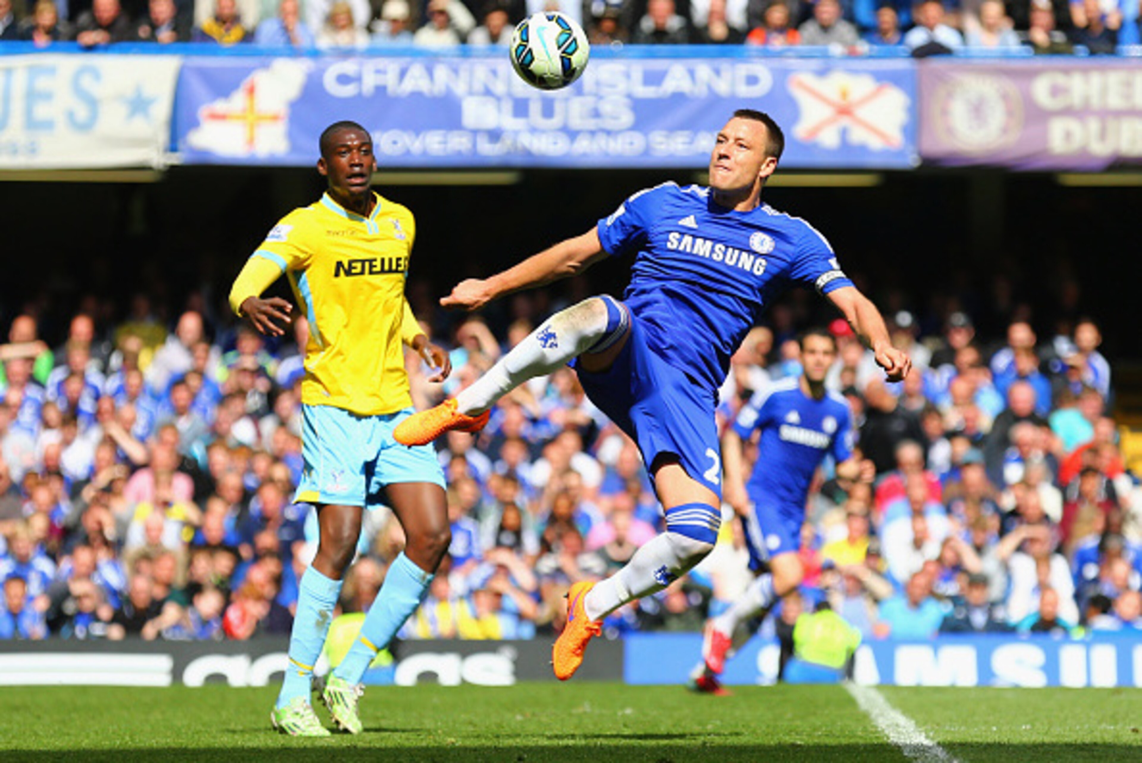 LONDON, ENGLAND - MAY 03:  John Terry of Chelsea jumps to clear the ball from Yaya Sanogo of Crystal Palace during the Barclays Premier League match between Chelsea and Crystal Palace at Stamford Bridge on May 3, 2015 in London, England.  (Photo by Clive 