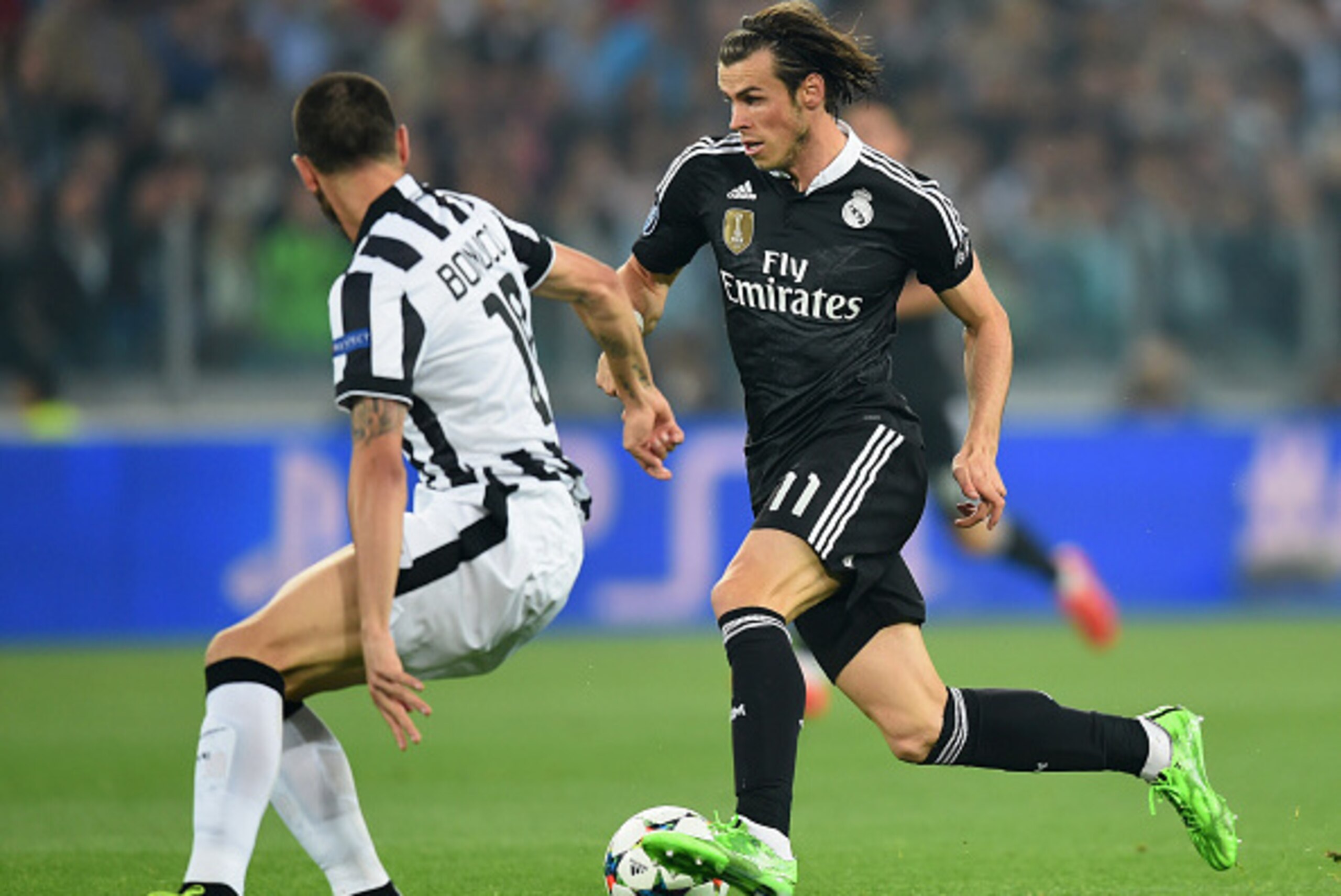 TURIN, ENGLAND - MAY 05:  Gareth Bale of Real Madrid CF takes on Leonardo Bonucci of Juventus during the UEFA Champions League semi final first leg match between Juventus and Real Madrid CF at Juventus Arena on May 5, 2015 in Turin, Italy.  (Photo by Mich