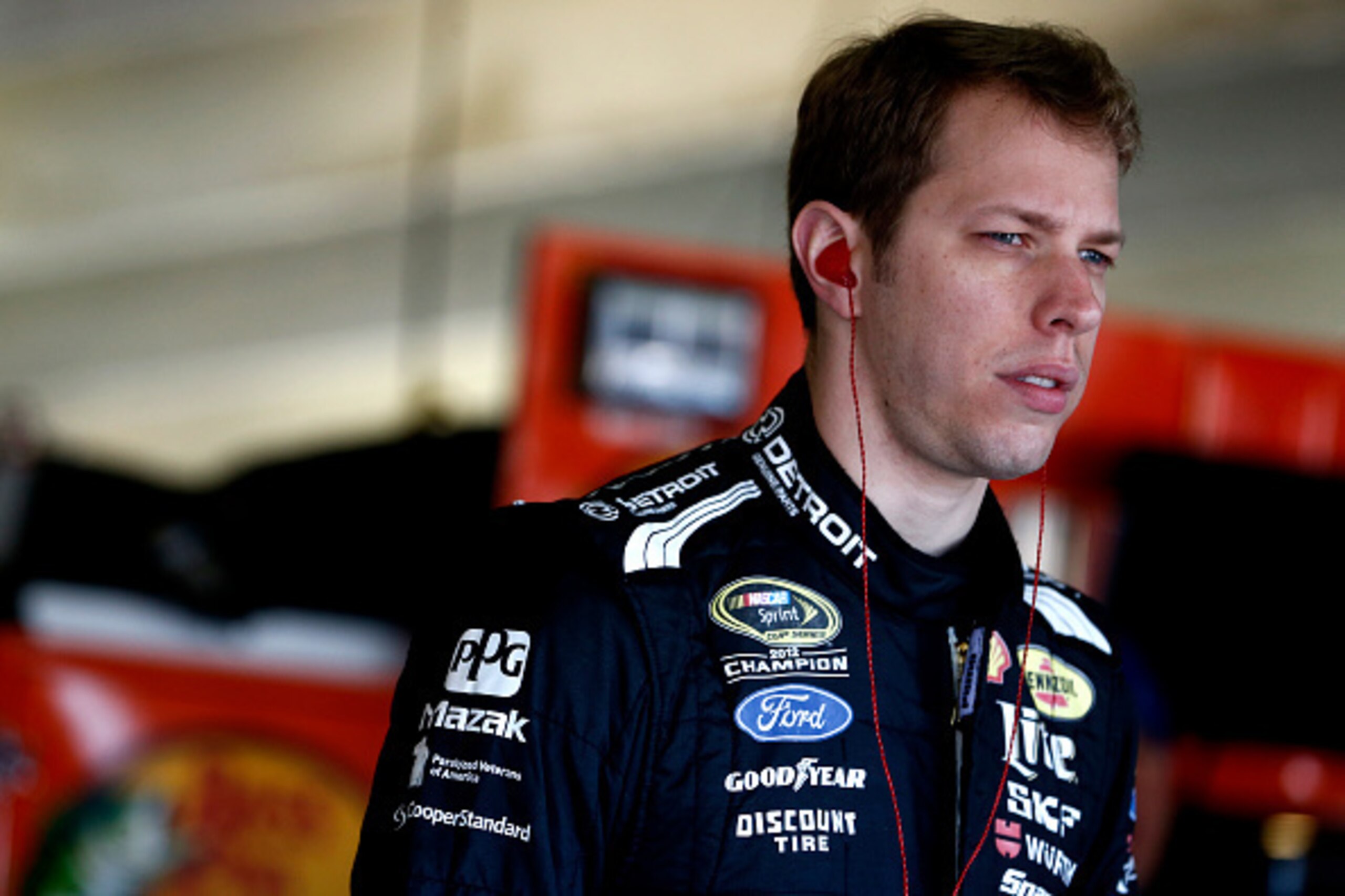 HAMPTON, GA - FEBRUARY 27:  Brad Keselowski, driver of the #2 Detroit Genuine Parts Ford, stands in the garage area during practice for the NASCAR Sprint Cup Series  Folds of Honor QuikTrip 500 at Atlanta Motor Speedway on February 27, 2015 in Hampton, Ge