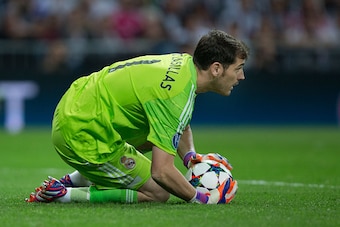 MADRID, SPAIN - APRIL 22: Goalkeeper Iker Casillas of Real Madrid CF stops the ball during the UEFA Champions League quarter-final second leg match between Real Madrid CF and Club Atletico de Madrid at Bernabeu on April 22, 2015 in Madrid, Spain.  (Photo 