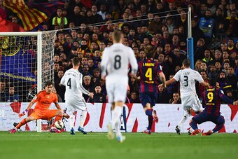 BARCELONA, SPAIN - MARCH 22:  Luis Suarez of Barcelona (9) shoots past goalkeeper Iker Casillas of Real Madrid CF to score their second goal during the La Liga match between FC Barcelona and Real Madrid CF at Camp Nou on March 22, 2015 in Barcelona, Spain