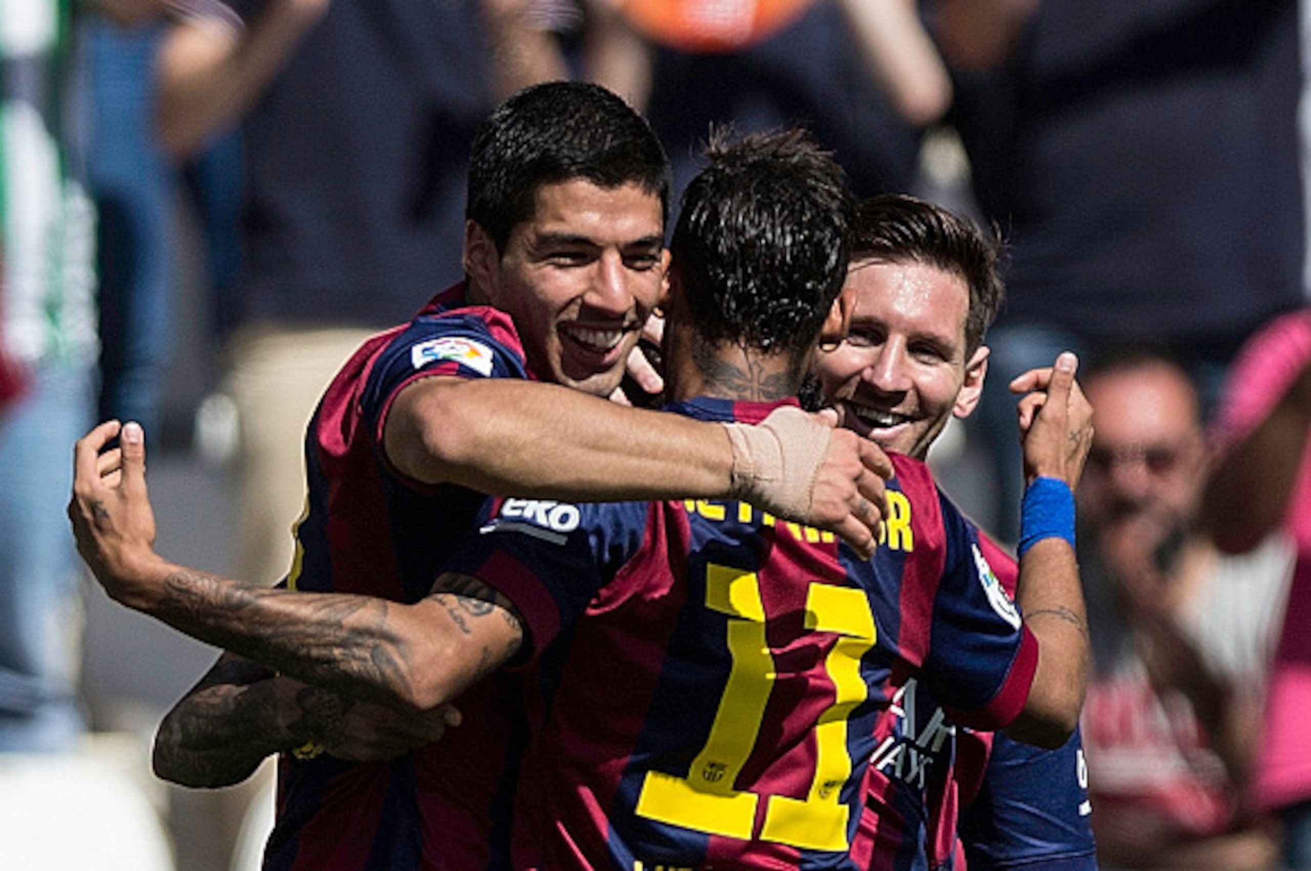 CORDOBA, SPAIN - MAY 02:  Luis Suarez (L) of FC Barcelona celebrates scoring their fourth goal with team-mates Neymar JR. (2ndL) and Lionel Messi (R) during the La Liga match between Cordoba CF and Barcelona FC at El Arcangel stadium on May 2, 2015 in Cor