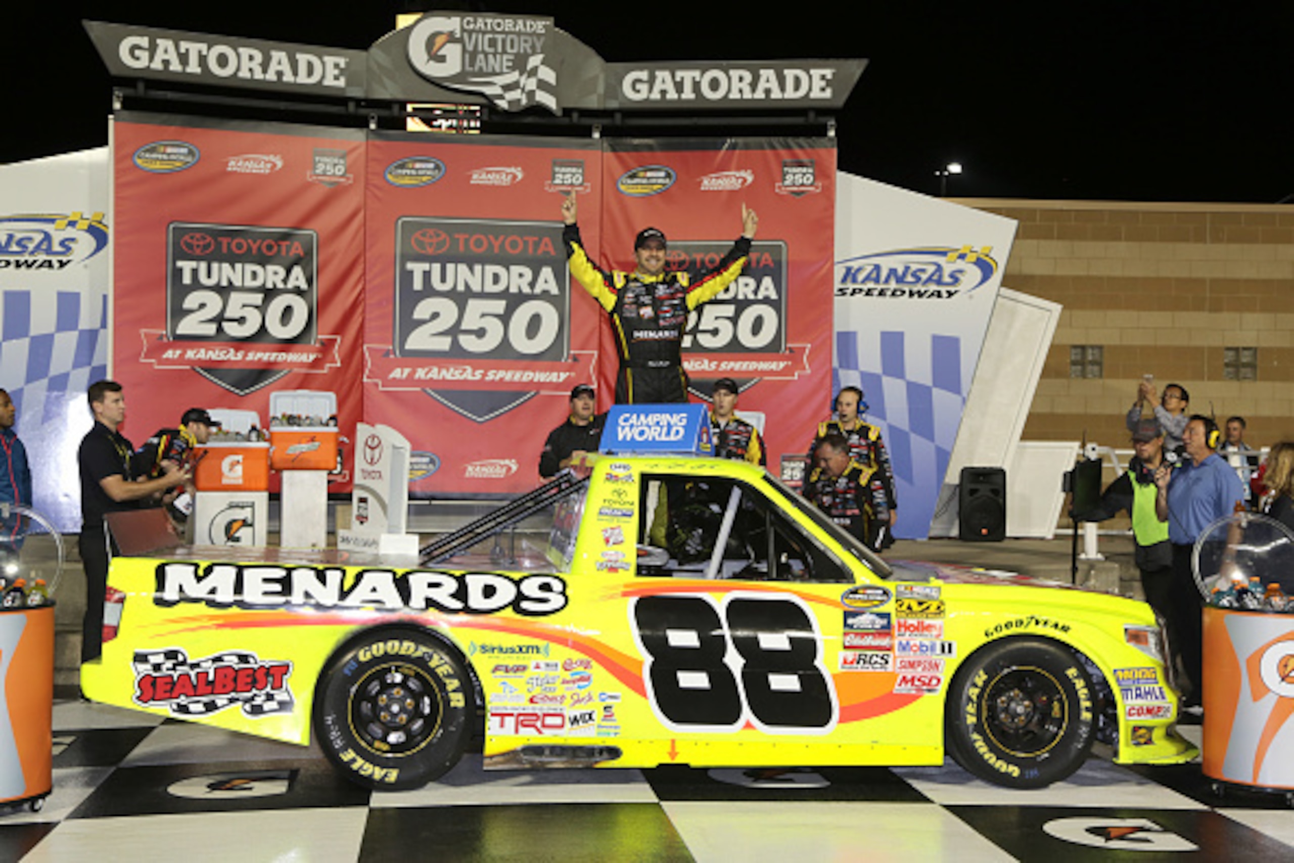 KANSAS CITY, KS - MAY 08:  Matt Crafton, driver of the #88 Slim Jim/Menards Toyota, celebrates in Victory Lane after winning the NASCAR Camping World Truck Series Toyota Tundra 250 at Kansas Speedway on May 8, 2015 in Kansas City, Kansas.  (Photo by Jerry