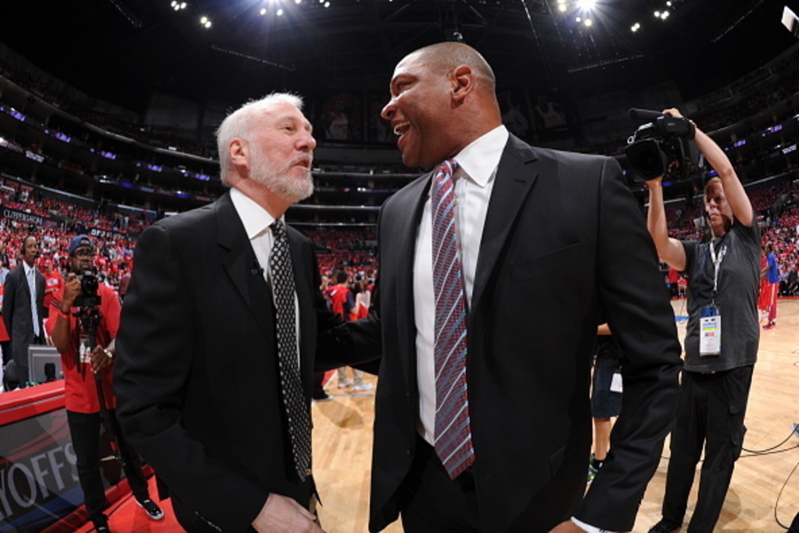 LOS ANGELES, CA - May 2:  Head Coach Gregg Popovich of the San Antonio Spurs greets Head Coach Doc Rivers of the Los Angeles Clippers before Game Seven of the Western Conference Quarterfinals during the 2015 NBA Playoffs on May 2, 2015 at Staples Center i