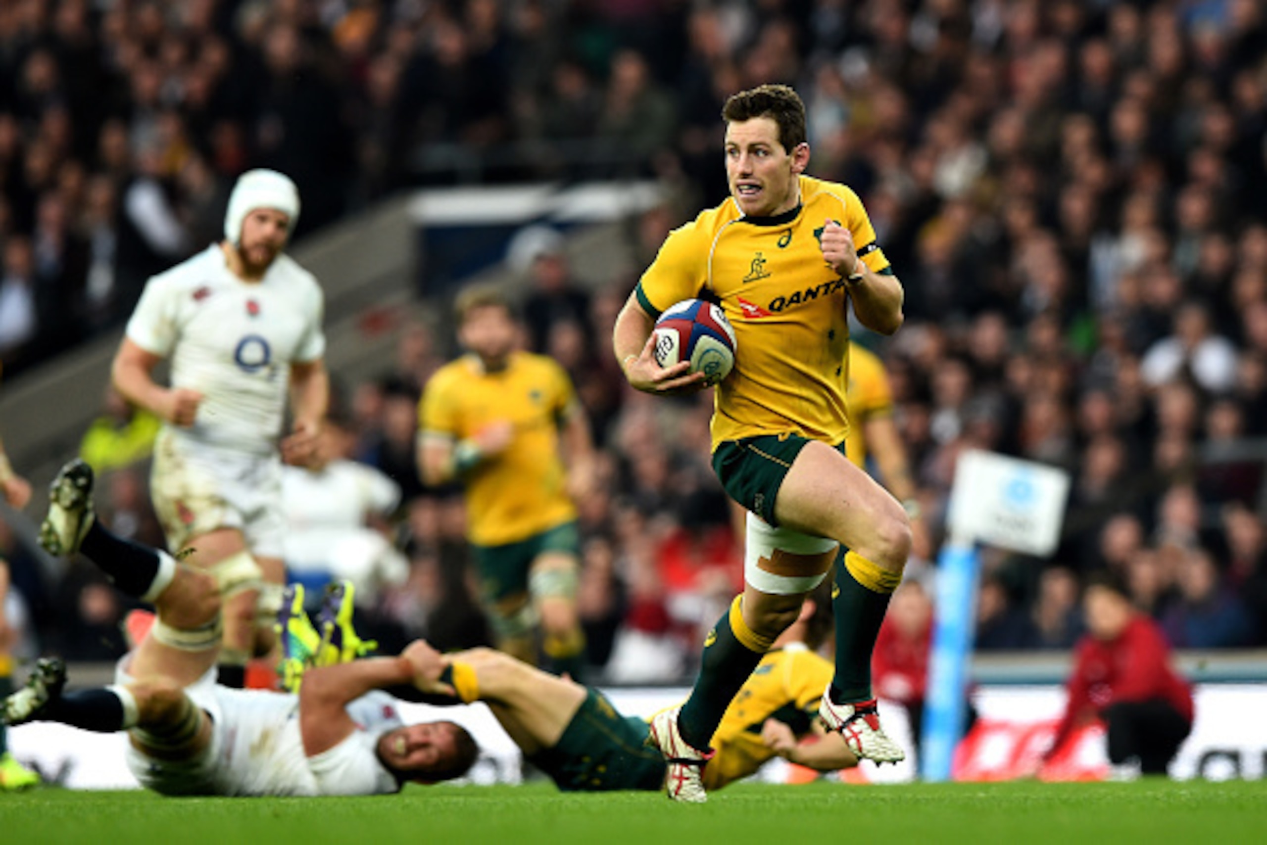 LONDON, ENGLAND - NOVEMBER 29:  Bernard Foley of Australia breaks through to score his team's first try during the QBE international match between England and Australia at Twickenham Stadium on November 29, 2014 in London, England.  (Photo by Shaun Botter