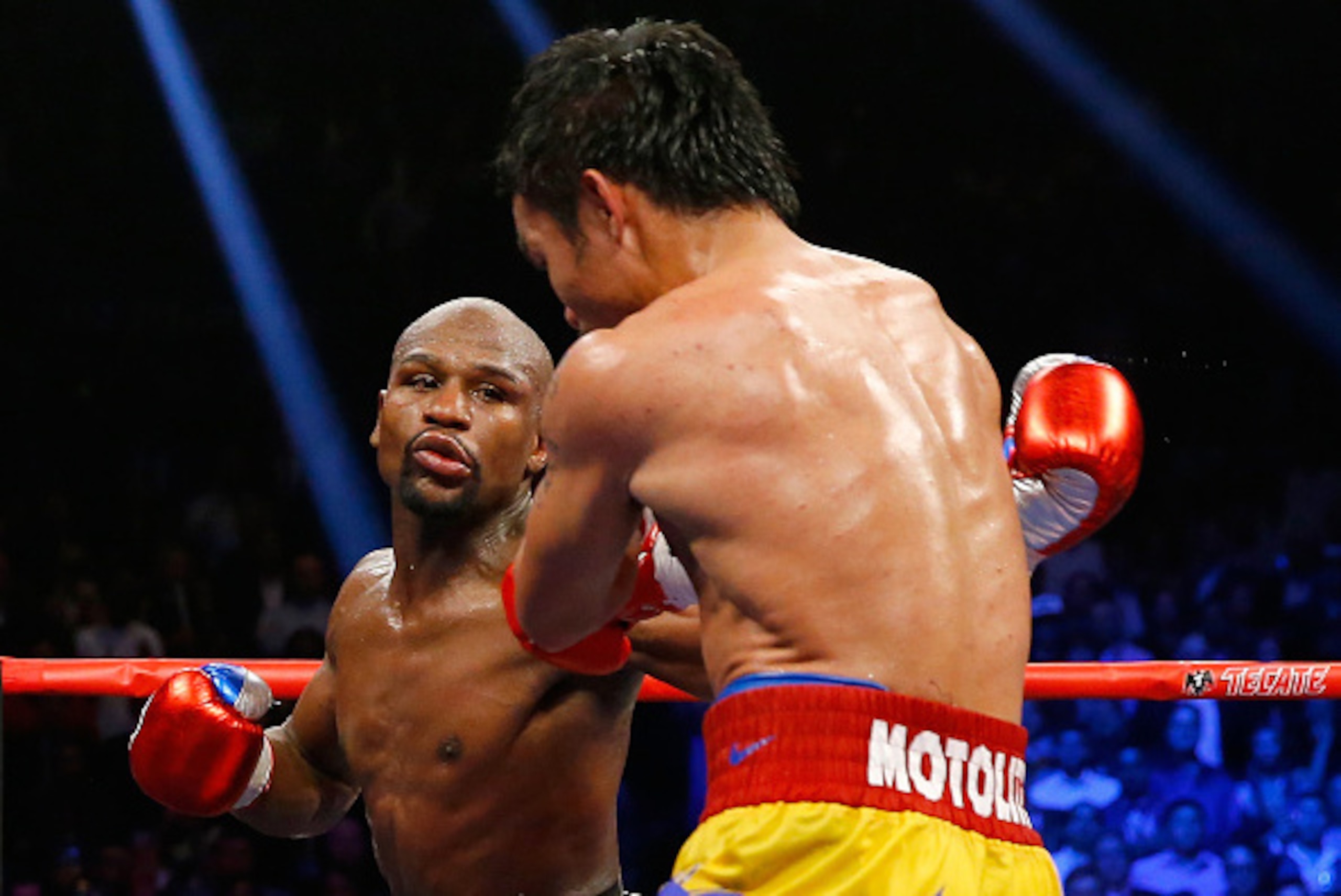 LAS VEGAS, NV - MAY 02:  Floyd Mayweather Jr. throws a left at Manny Pacquiao during their welterweight unification championship bout on May 2, 2015 at MGM Grand Garden Arena in Las Vegas, Nevada.  (Photo by Al Bello/Getty Images)