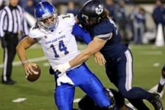 Nov 21, 2014; Logan, UT, USA; San Jose State Spartans quarterback Blake Jurich (14) is sacked by Utah State Aggies linebacker Zach Vigil (53) at Romney Stadium. Mandatory Credit: Chris Nicoll-USA TODAY Sports