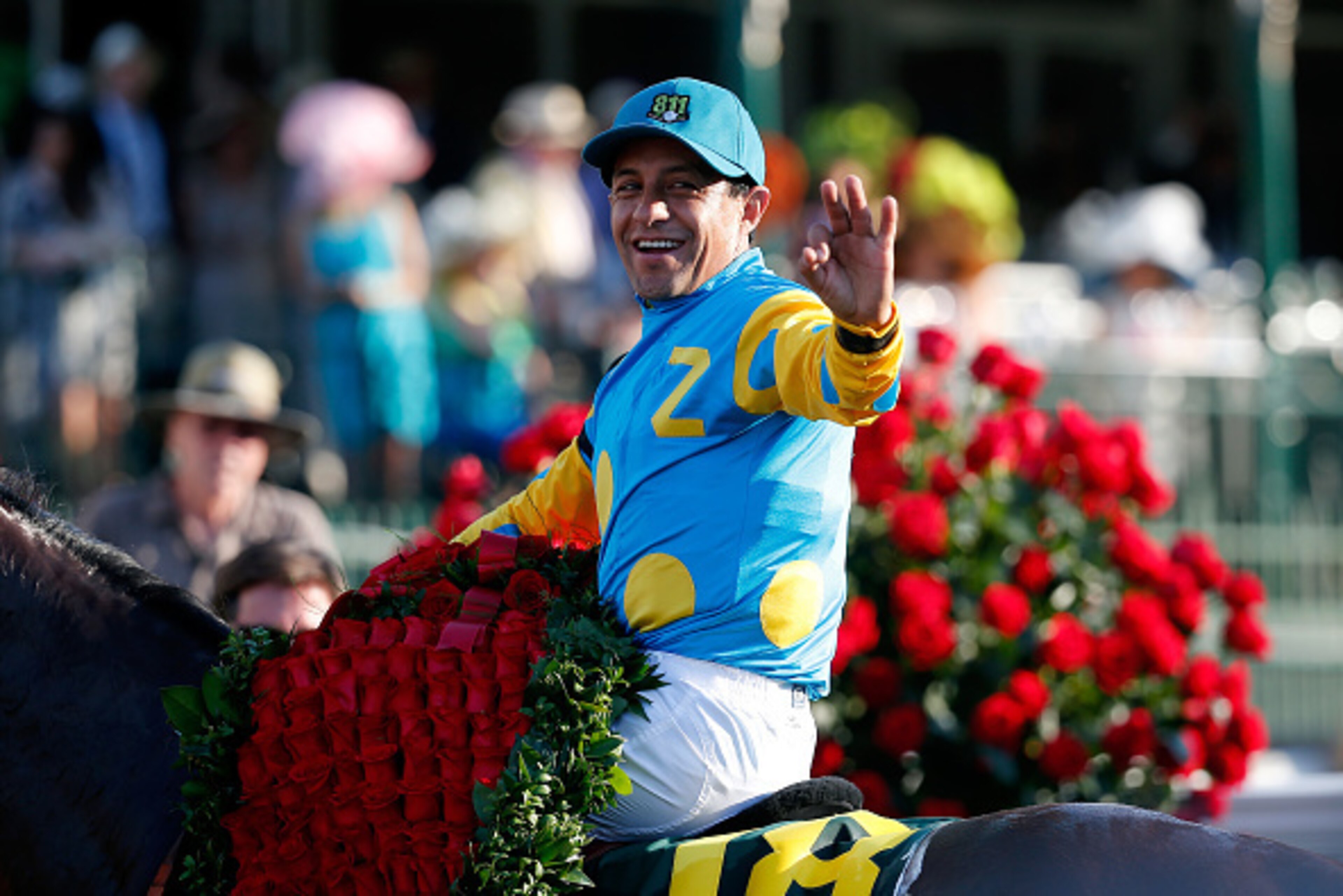 LOUISVILLE, KY - MAY 02:  Jockey Victor Espinoza celebrates atop of American Pharoah #18 in winners circle after winning the 141st running of the Kentucky Derby at Churchill Downs on May 2, 2015 in Louisville, Kentucky.  (Photo by Rob Carr/Getty Images)