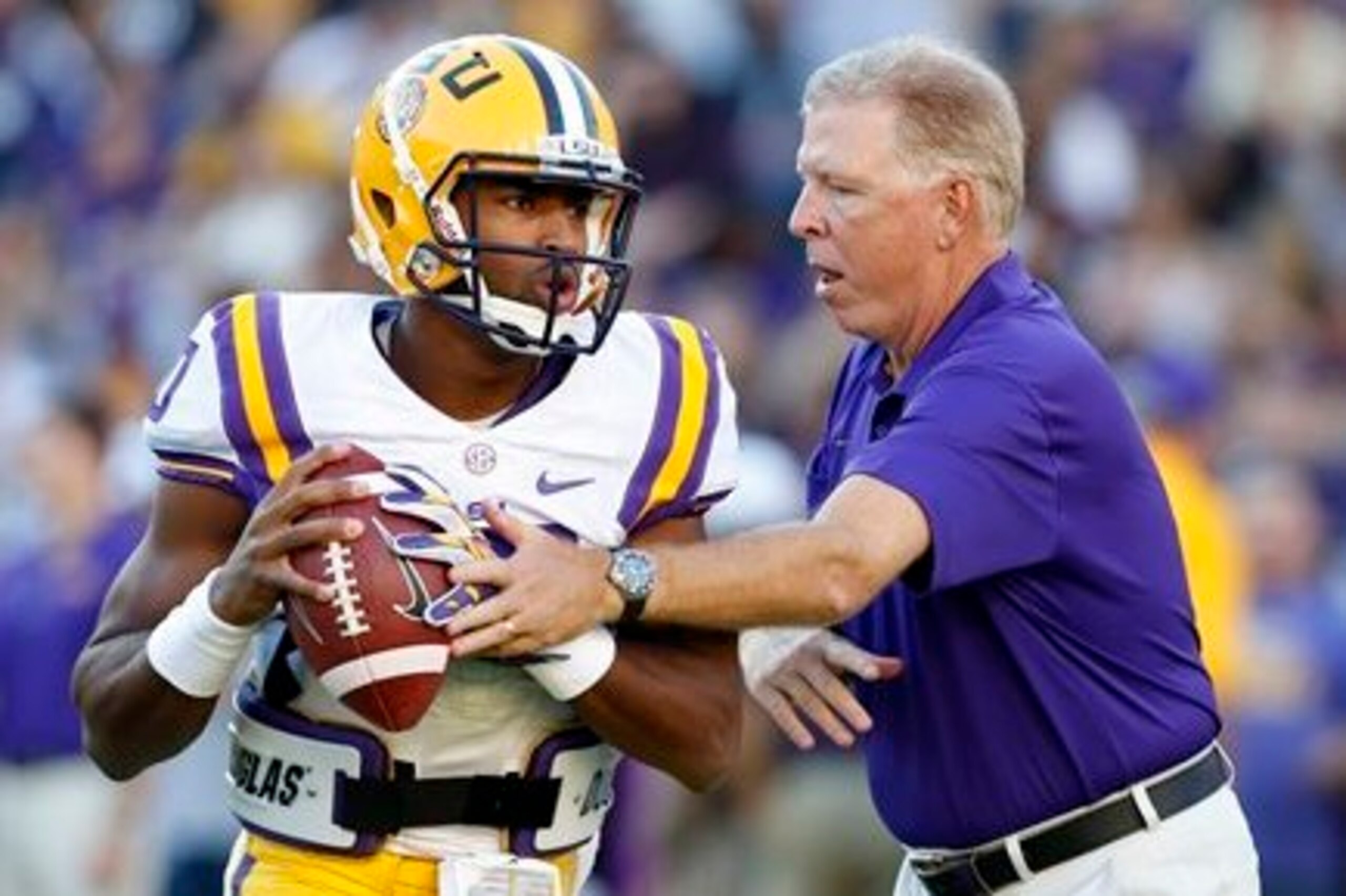 LSU QB Anthony Jennings (left) and OC Cam Cameron