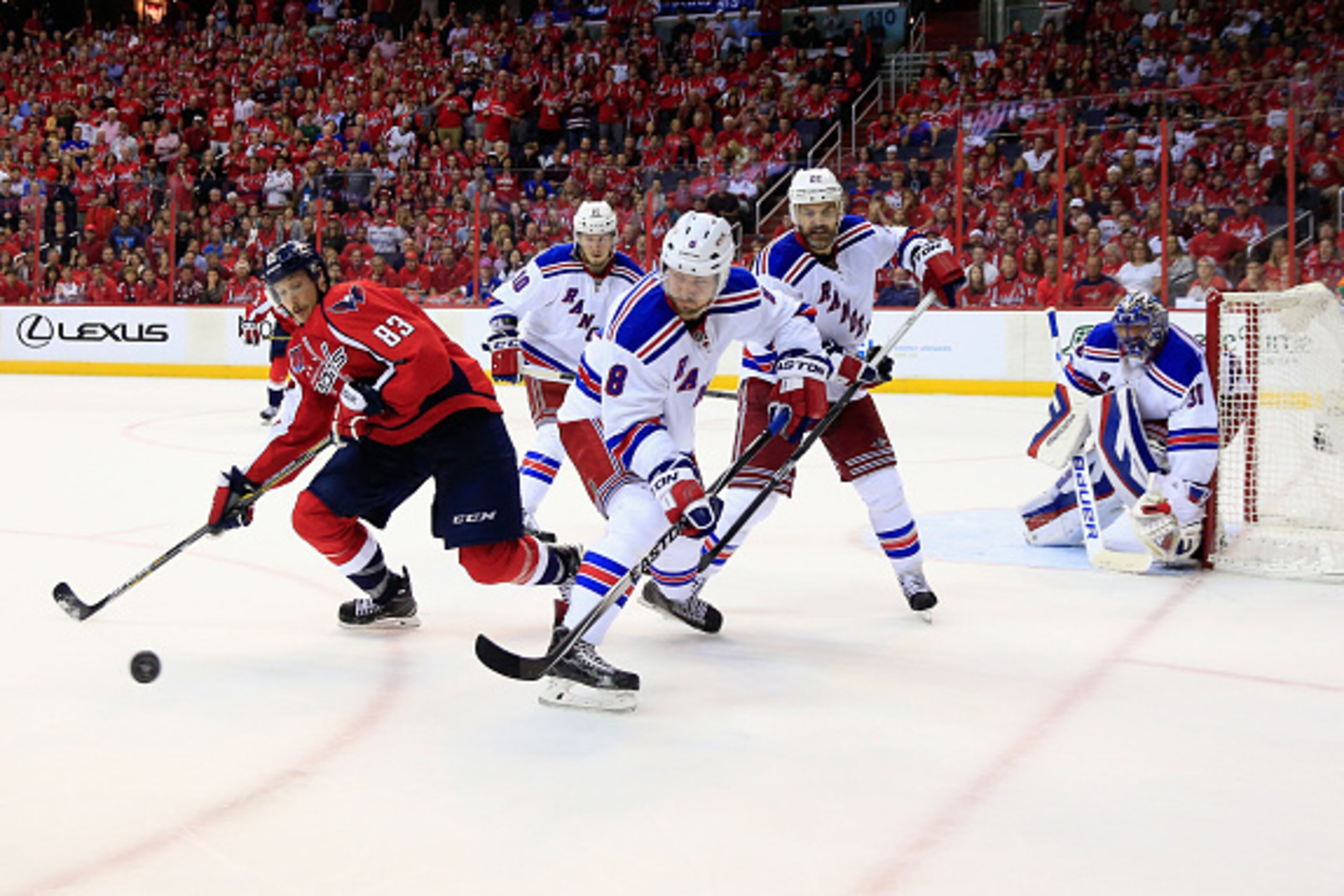 WASHINGTON, DC - MAY 10: Jay Beagle #83 of the Washington Capitals and Kevin Klein #8 of the New York Rangers go after the puck in the third period of the Rangers 4-3 win during Game Six of the Eastern Conference Semifinals during the 2015 NHL Stanley Cup