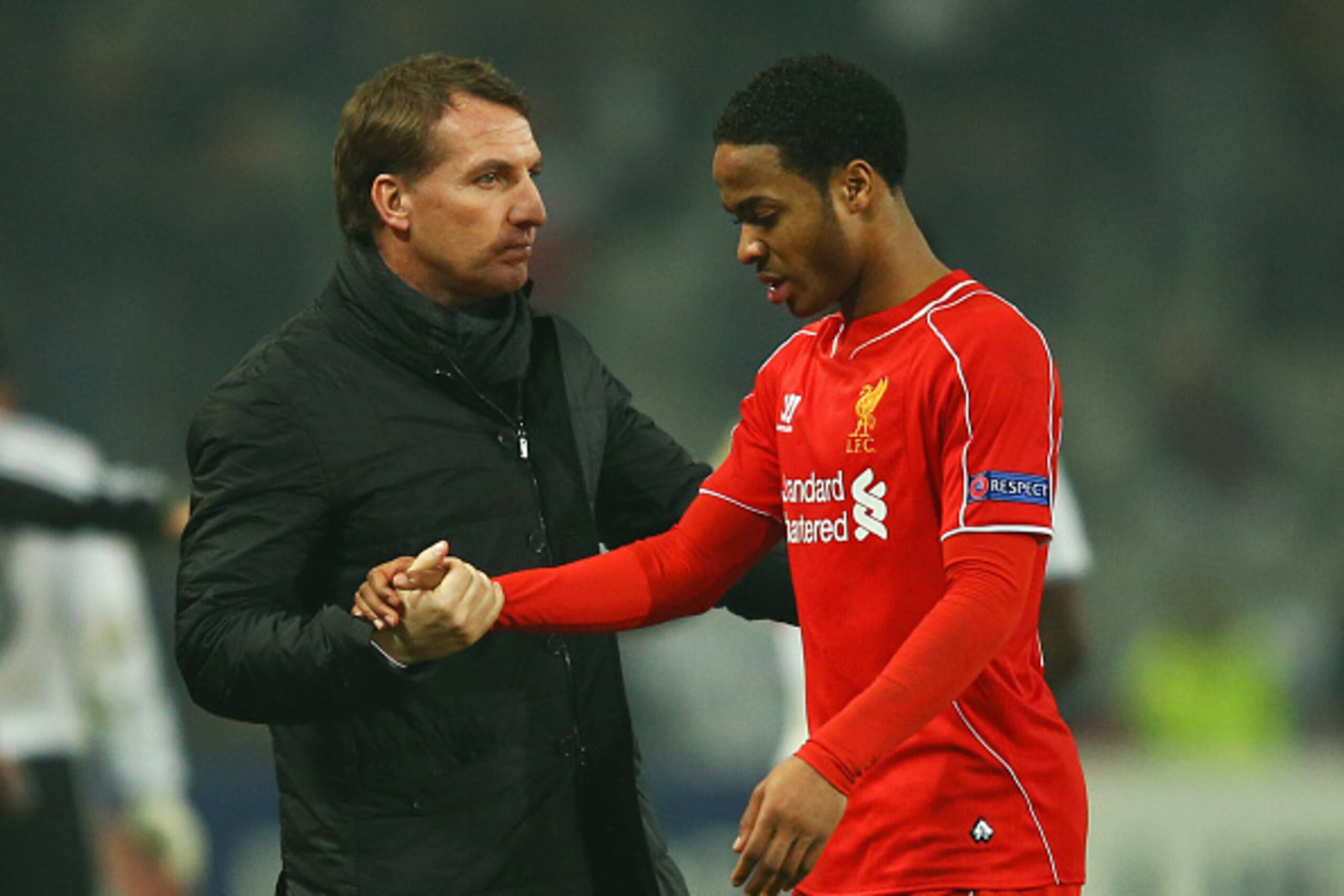 ISTANBUL, TURKEY - FEBRUARY 26:  Brendan Rodgers manager of Liverpool shakes hands with Raheem Sterling of Liverpool after defeat in a penalty shoot out during the UEFA Europa League Round of 32 second leg match between Besiktas JK and Liverpool FC on Feb