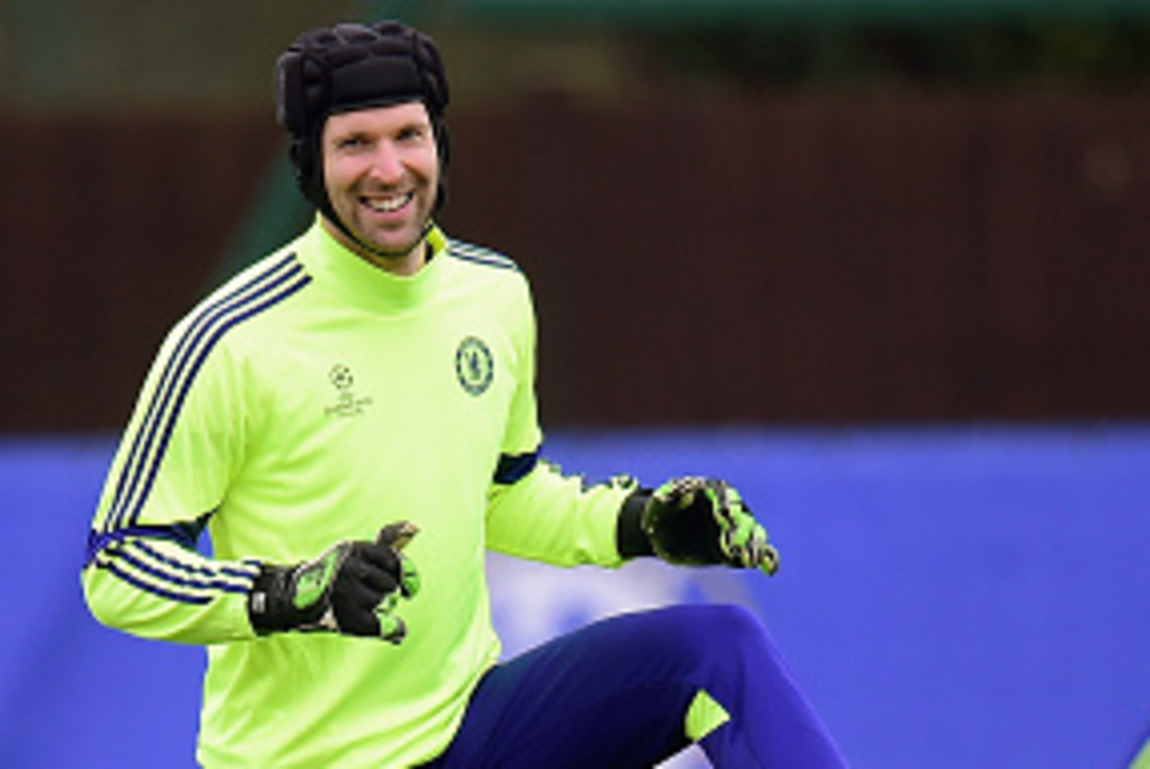 LONDON, ENGLAND - FEBRUARY 16:  Goalkeeper Petr Cech of Chelsea smiles as he warms up during a Chelsea training session ahead of the UEFA Champions League round of 16 match against Paris Saint-Germain at Cobham Training Centre on February 16, 2015 in Lond