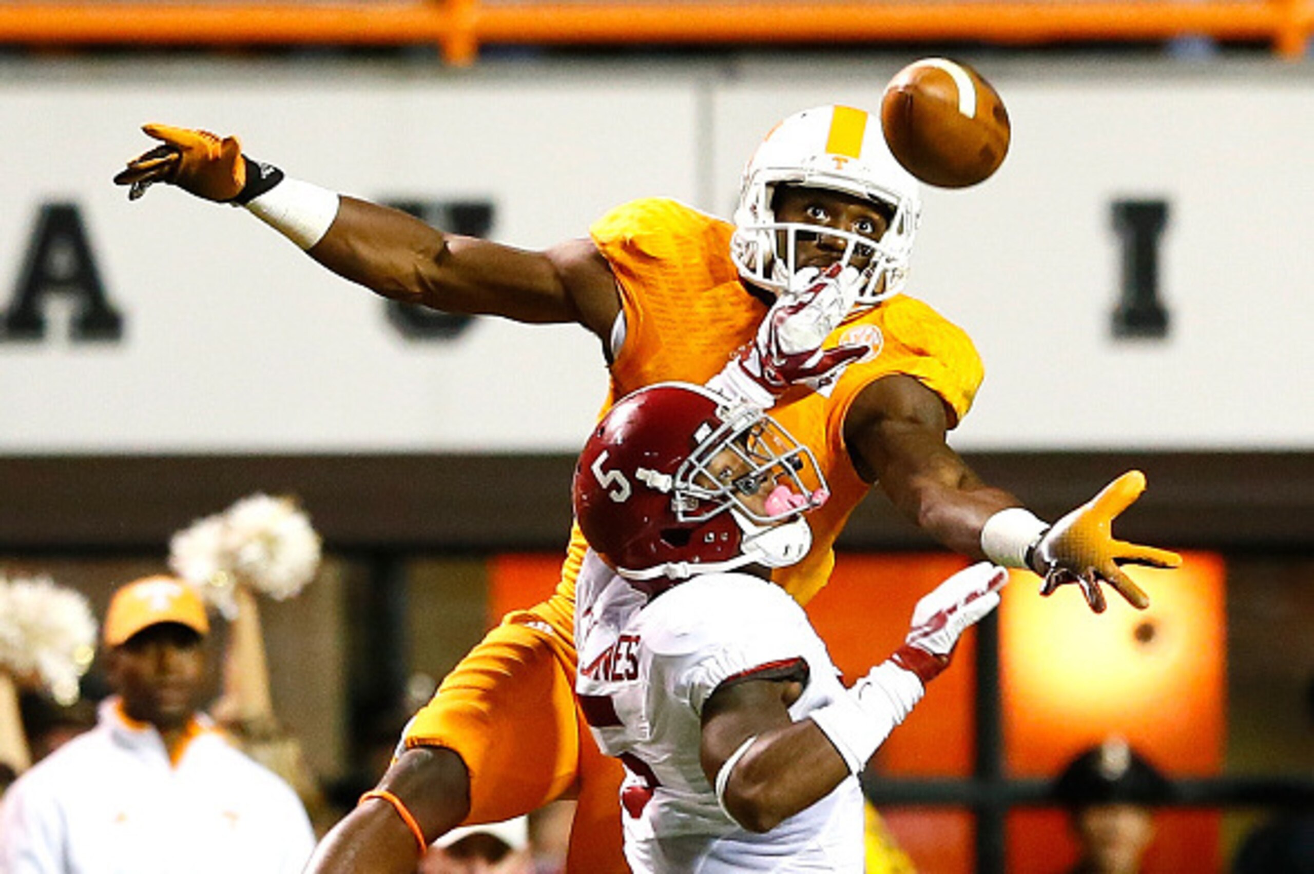 KNOXVILLE, TN - OCTOBER 25:  Cyrus Jones #5 of the Alabama Crimson Tide is flagged for pass interference as Marquez North #8 of the Tennessee Volunteers fails to pull in this reception at Neyland Stadium on October 25, 2014 in Knoxville, Tennessee.  (Phot