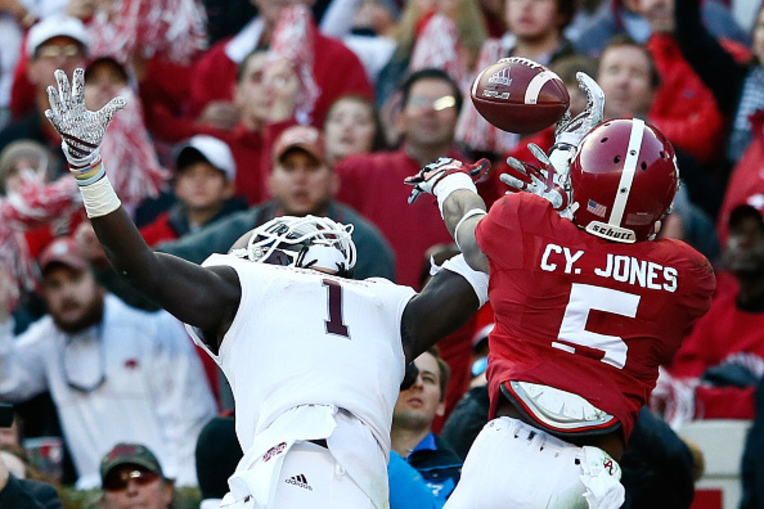 TUSCALOOSA, AL - NOVEMBER 15:  Cyrus Jones #5 of the Alabama Crimson Tide breaks up this touchdown reception intended for De'Runnya Wilson #1 of the Mississippi State Bulldogs at Bryant-Denny Stadium on November 15, 2014 in Tuscaloosa, Alabama.  (Photo by
