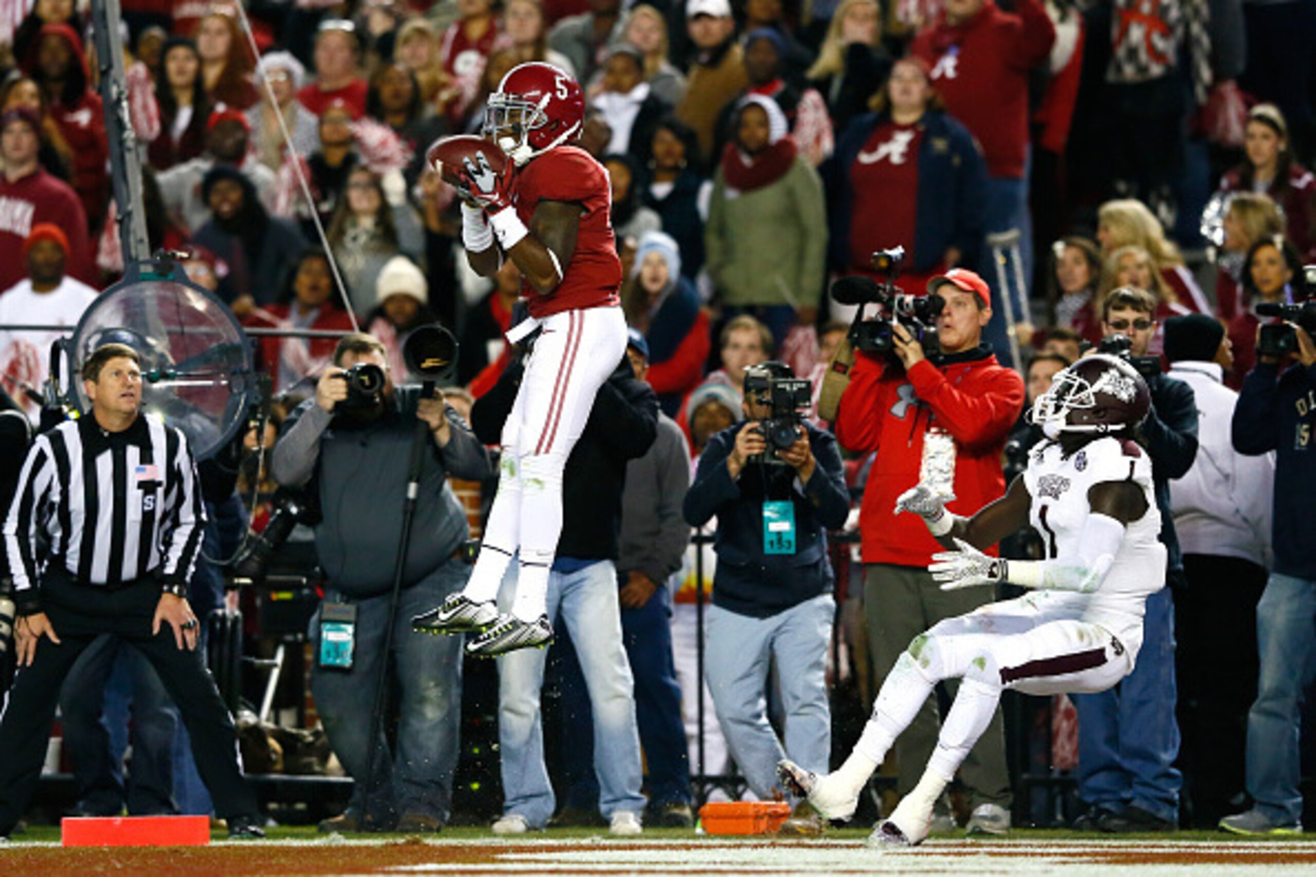 TUSCALOOSA, AL - NOVEMBER 15:  Cyrus Jones #5 of the Alabama Crimson Tide intercepts a touchdown reception intended for De'Runnya Wilson #1 of the Mississippi State Bulldogs at Bryant-Denny Stadium on November 15, 2014 in Tuscaloosa, Alabama.  (Photo by K