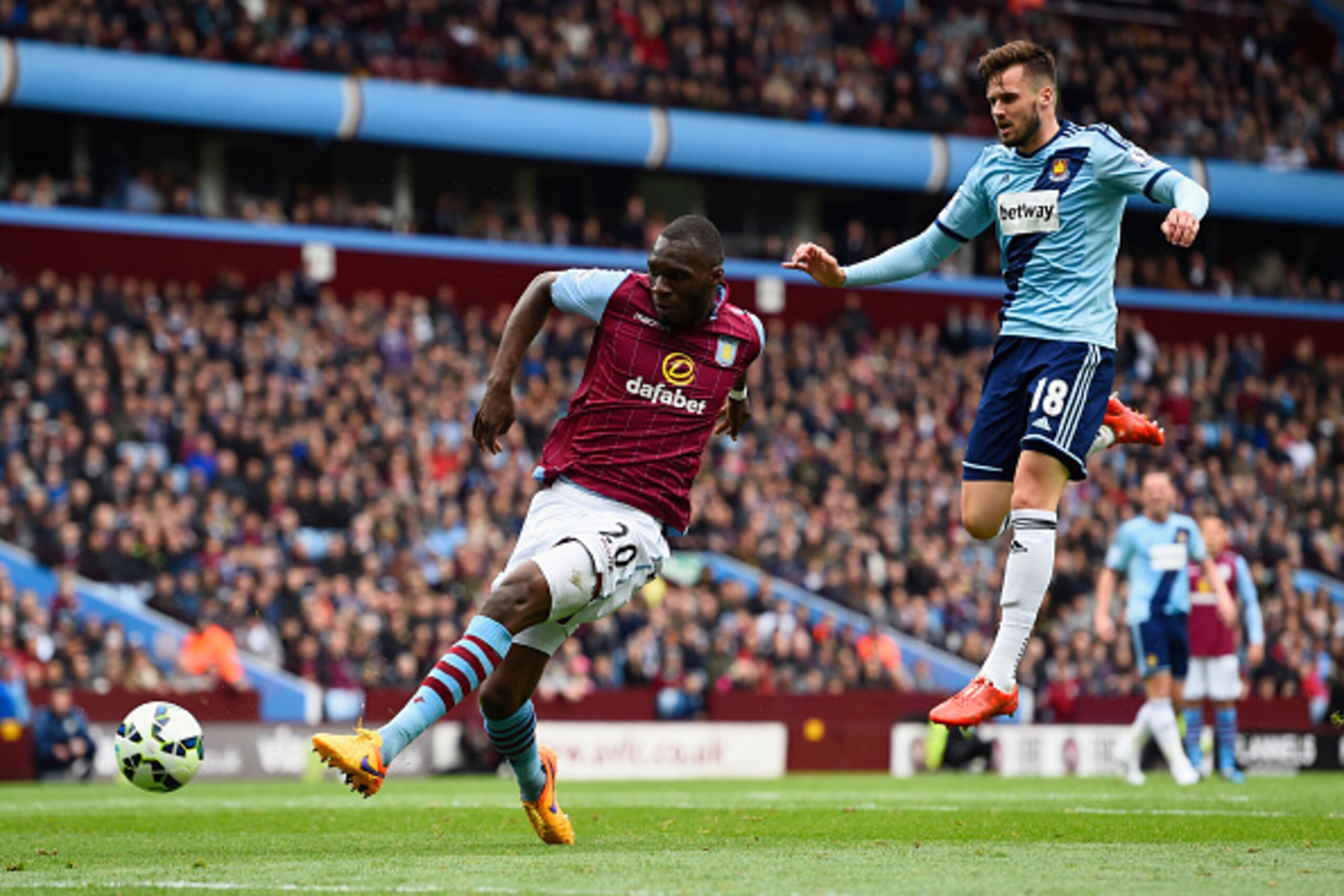BIRMINGHAM, ENGLAND - MAY 09: Christian Benteke of Aston Villa misses a chance at goal with Carl Jenkinson of West Ham United during the Barclays Premier League match between Aston Villa and West Ham United at Villa Park on May 9, 2015 in Birmingham, Engl BIRMINGHAM, ENGLAND - MAY 09: Christian Benteke of Aston Villa misses a chance at goal with Carl Jenkinson of West Ham United during the Barclays Premier League match between Aston Villa and West Ham United at Villa Park on May 9, 2015 in Birmingham, Engl