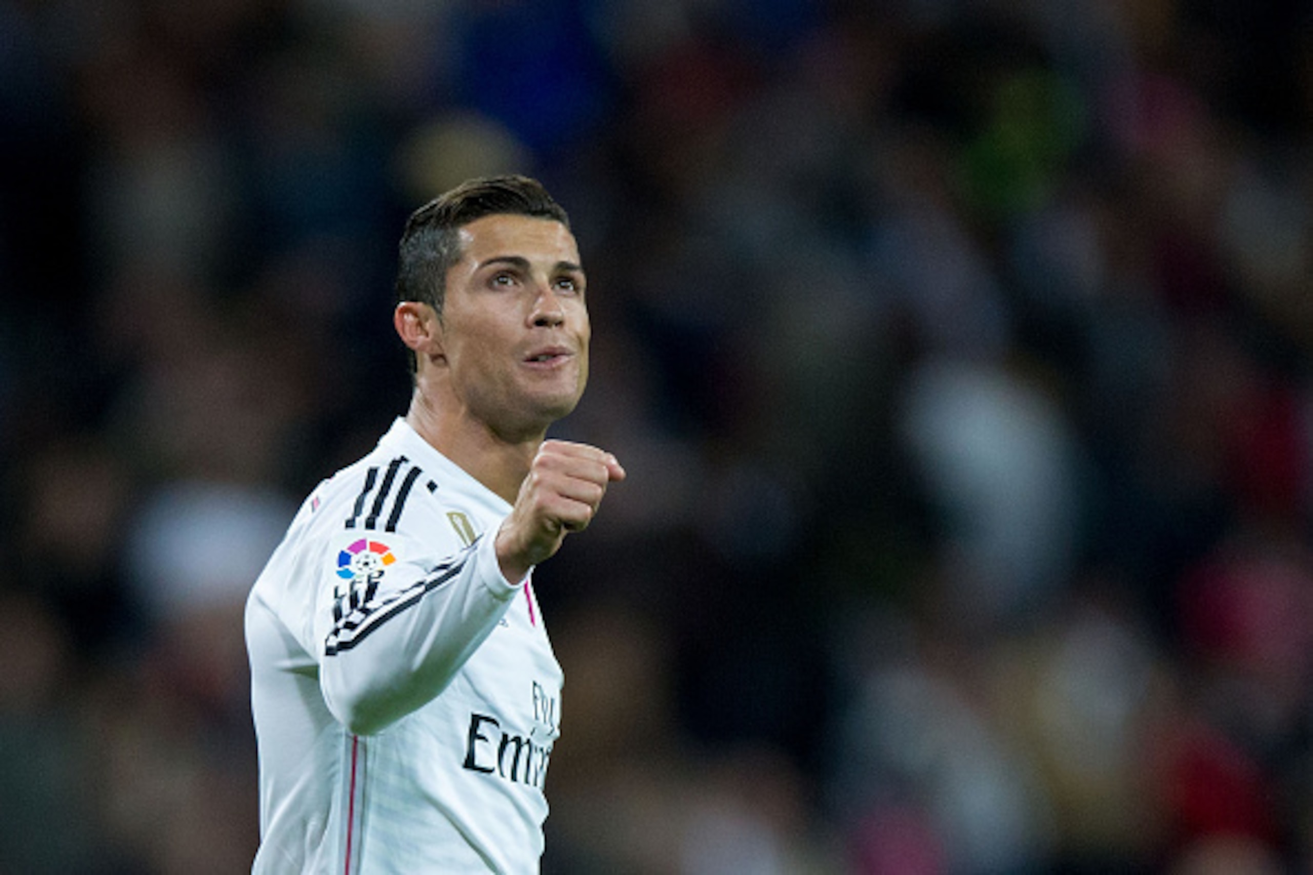 MADRID, SPAIN - APRIL 18:  Cristiano Ronaldo of Real Madrid CF celebrates scoring their third goal during the La Liga match between Real Madrid CF and Malaga CF at Estadio Santiago Bernabeu on April 18, 2015 in Madrid, Spain.  (Photo by Gonzalo Arroyo Mor