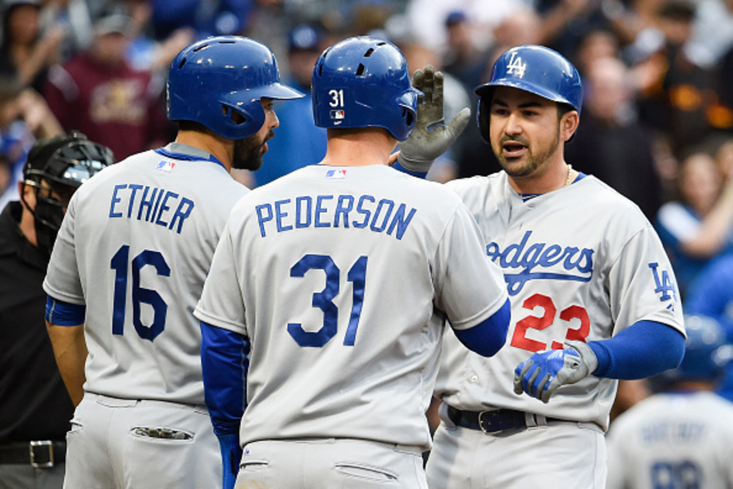 SAN DIEGO, CA - APRIL  25:  Adrian Gonzalez #23 of the Los Angeles Dodgers, right, is congratulated by Andre Ethier #16 and Joc Pederson #31 after he hit a three-run home run during the second inning of a baseball game against the San Diego Padres at Petc