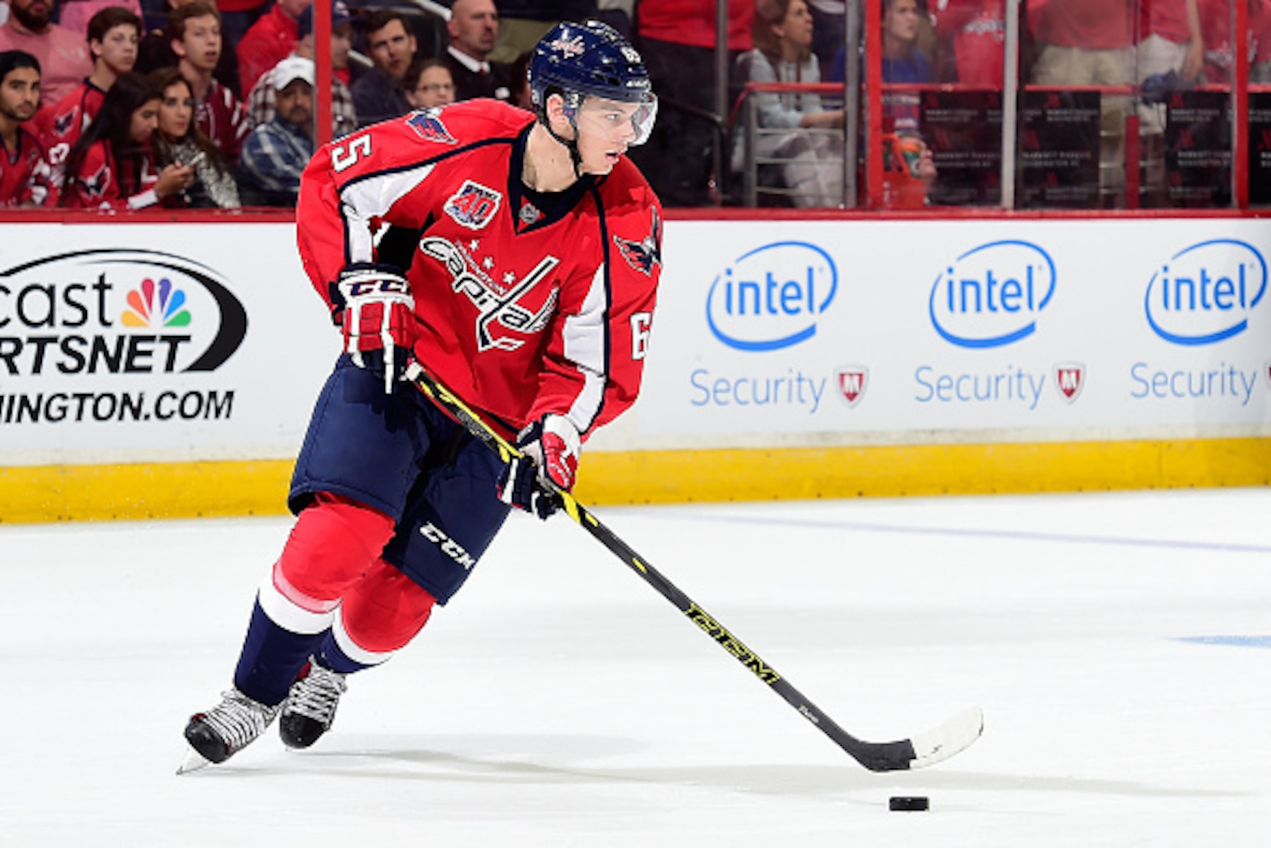 WASHINGTON, DC - MAY 10:  Andre Burakovsky #65 of the Washington Capitals controls the puck against the New York Rangers during the third period in Game Six of the Eastern Conference Semifinals during the 2015 NHL Stanley Cup Playoffs at Verizon Center on