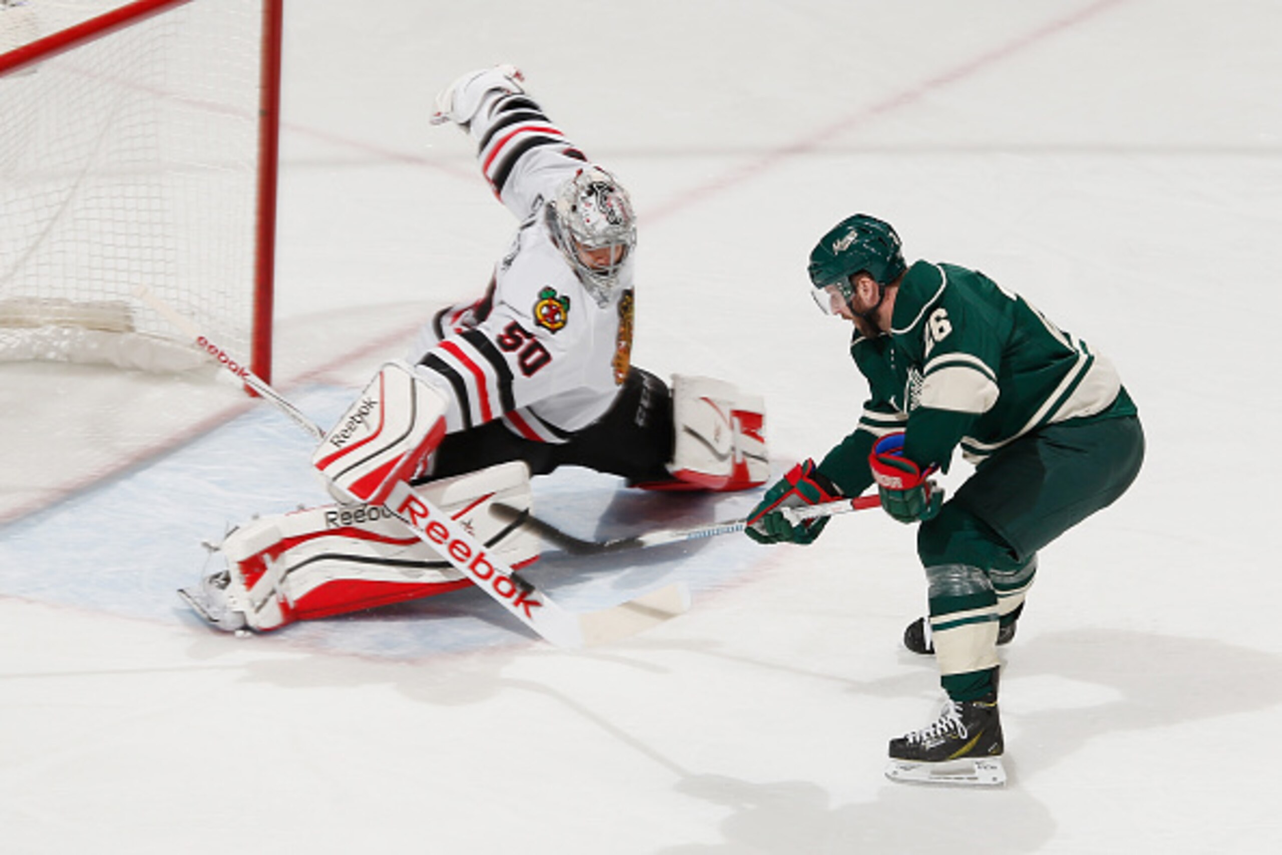 ST. PAUL, MN - MAY 7: Corey Crawford #50 of the Chicago Blackhawks makes a save against Thomas Vanek #26 of the Minnesota Wild in Game Four of the Western Conference Semifinals during the 2015 NHL Stanley Cup Playoffs on May 7, 2015 at the Xcel Energy Cen