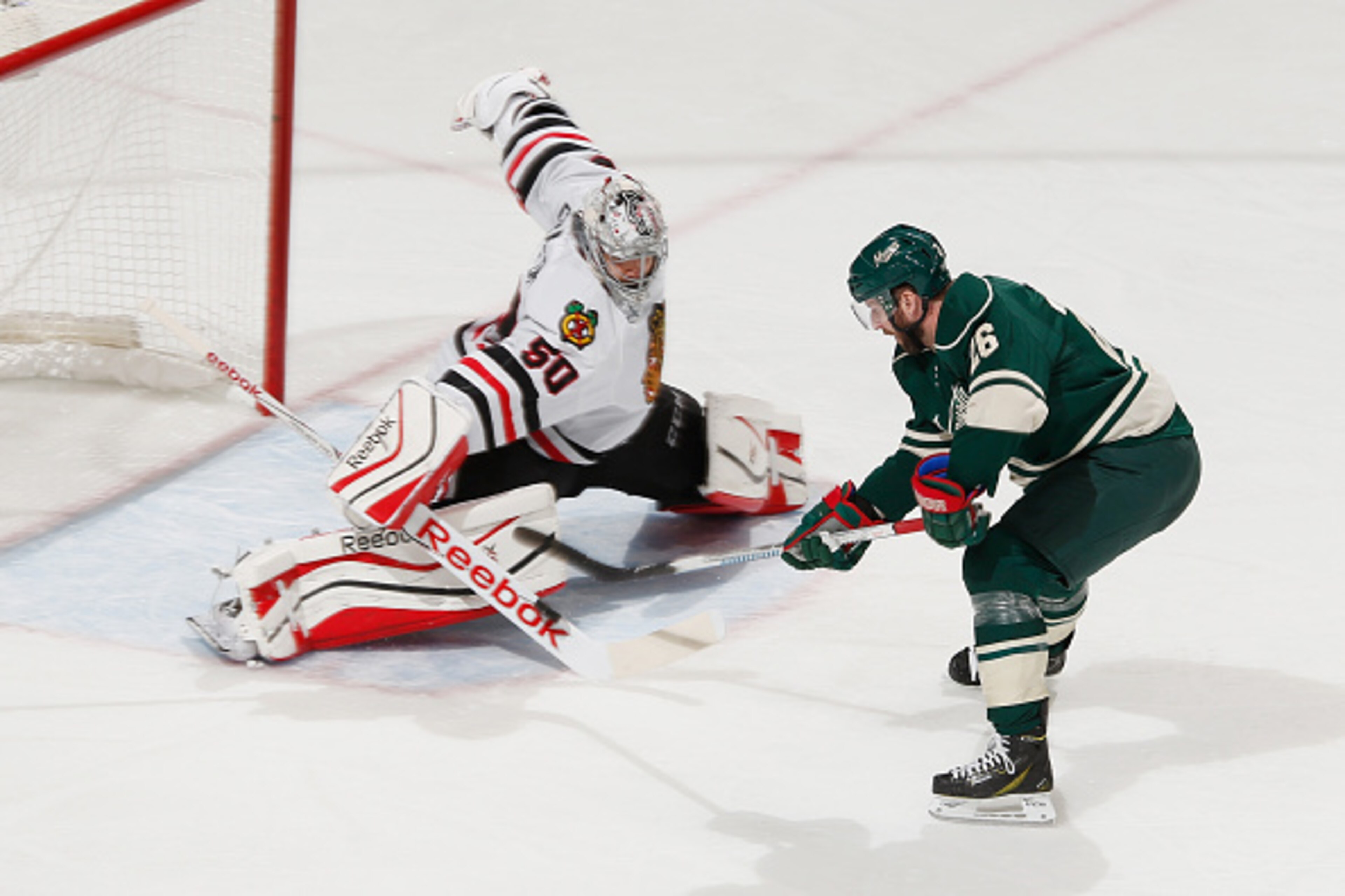 ST. PAUL, MN - MAY 7: Corey Crawford #50 of the Chicago Blackhawks makes a save against Thomas Vanek #26 of the Minnesota Wild in Game Four of the Western Conference Semifinals during the 2015 NHL Stanley Cup Playoffs on May 7, 2015 at the Xcel Energy Cen