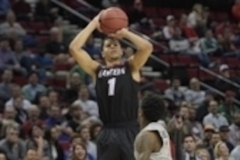 Mar 19, 2015; Portland, OR, USA; Eastern Washington Eagles guard Tyler Harvey (top) shoots the basketball against Georgetown Hoyas guard Tre Campbell (bottom) during the second half in the second round of the 2015 NCAA Tournament at Moda Center. Mandatory