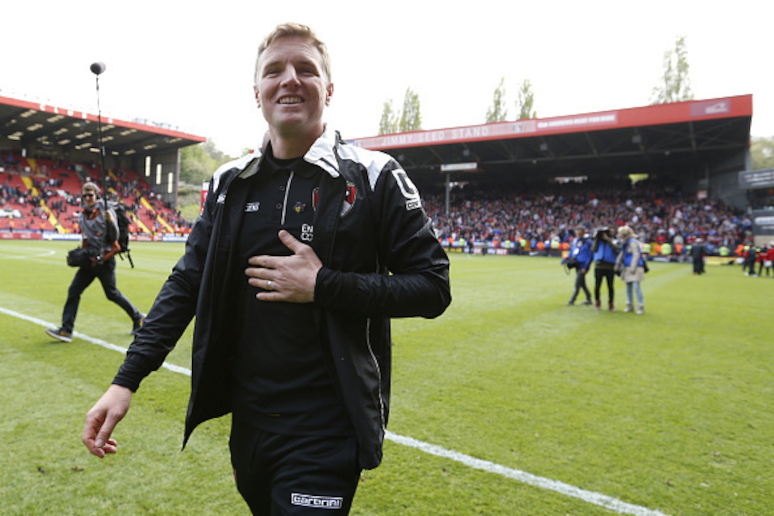 LONDON, ENGLAND - MAY 02: Eddie Howe, manager of Bournemouth celebrates on the pitch after winning the Championship during the Sky Bet Championship match between Charlton Athletic and AFC Bournemouth at The Valley on May 2, 2015 in London, England. (Photo