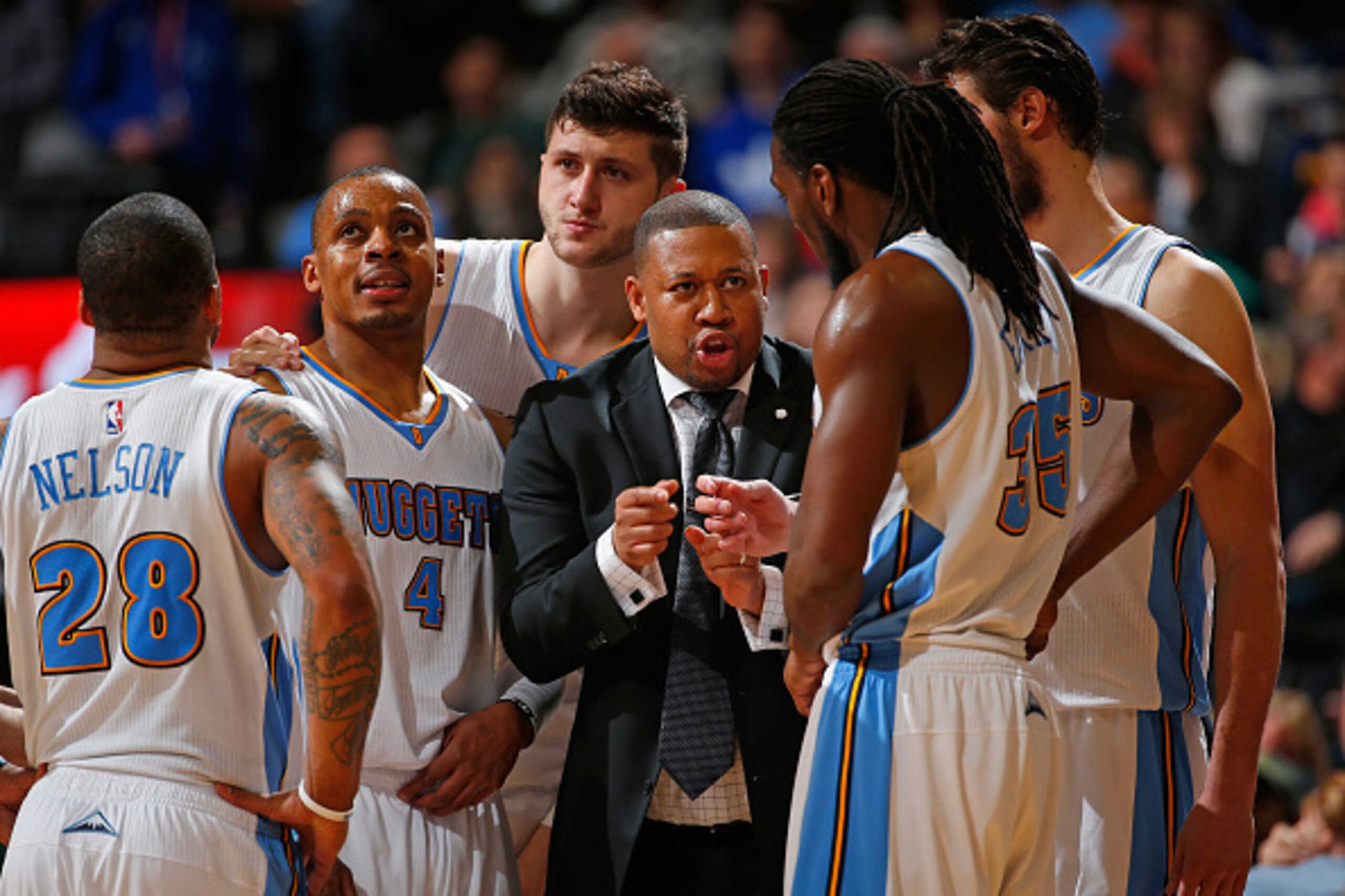 DENVER, CO - MARCH 13:  Interim head coach Melvin Hunt of the Denver Nuggets leads Jameer Nelson #28, Randy Foye #4, Jusuf Nurkic #23, Kenneth Faried #35 and Danilo Gallinari #8 of the Denver Nuggets against the Golden State Warriors at Pepsi Center on Ma