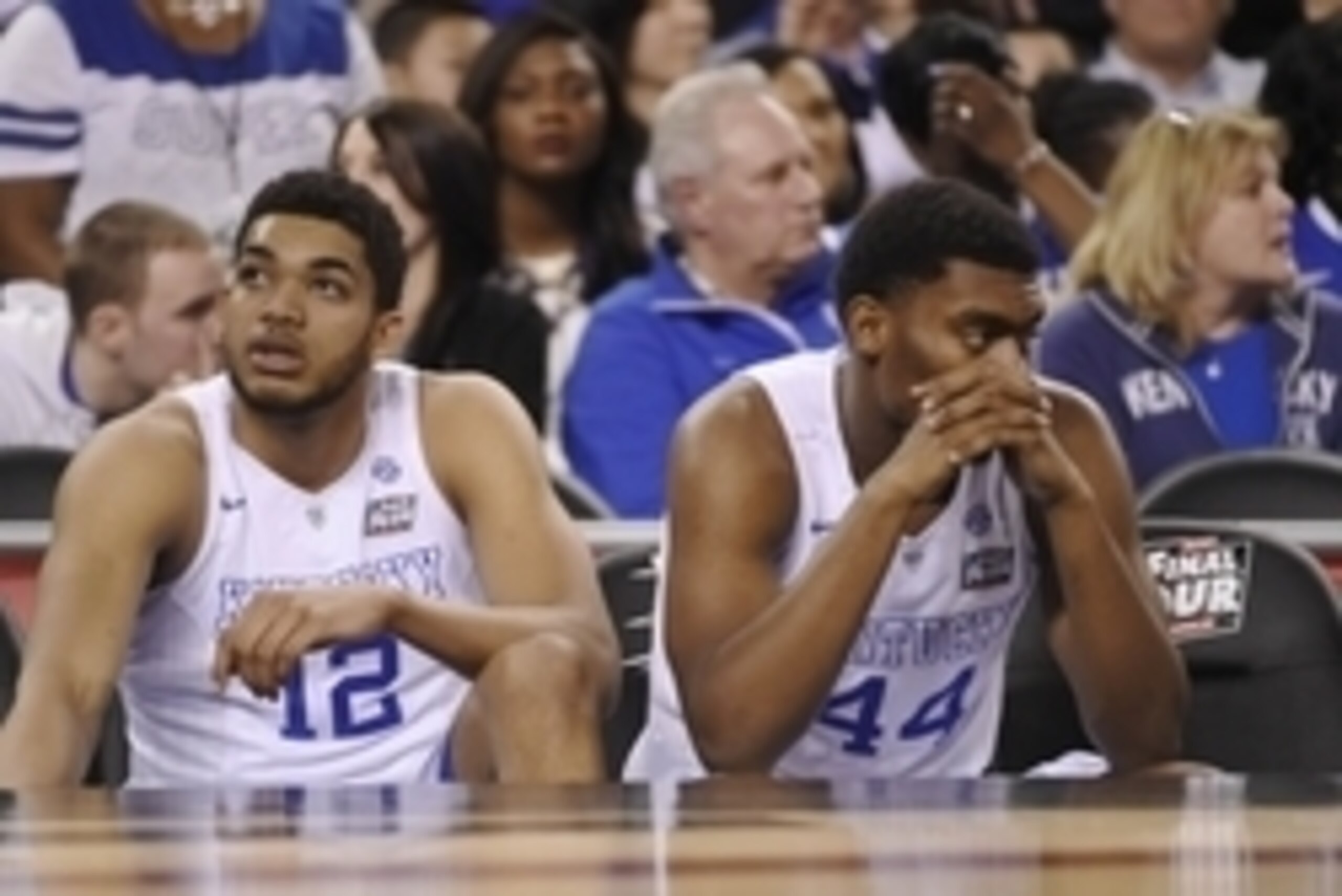 Apr 4, 2015; Indianapolis, IN, USA; Kentucky Wildcats forward Karl-Anthony Towns (12) and Dakari Johnson (44) sit on the bench following their loss to the Wisconsin Badgers 71-64 in the 2015 NCAA Men's Division I Championship semi-final game at Lucas Oil 