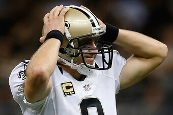 NEW ORLEANS, LA - SEPTEMBER 30:   Drew Brees #9 of the New Orleans Saints reacts to a fumble during the game against the Miami Dolphins at the Mercedes-Benz Superdome on September 30, 2013 in New Orleans, Louisiana.  (Photo by Chris Graythen/Getty Images)