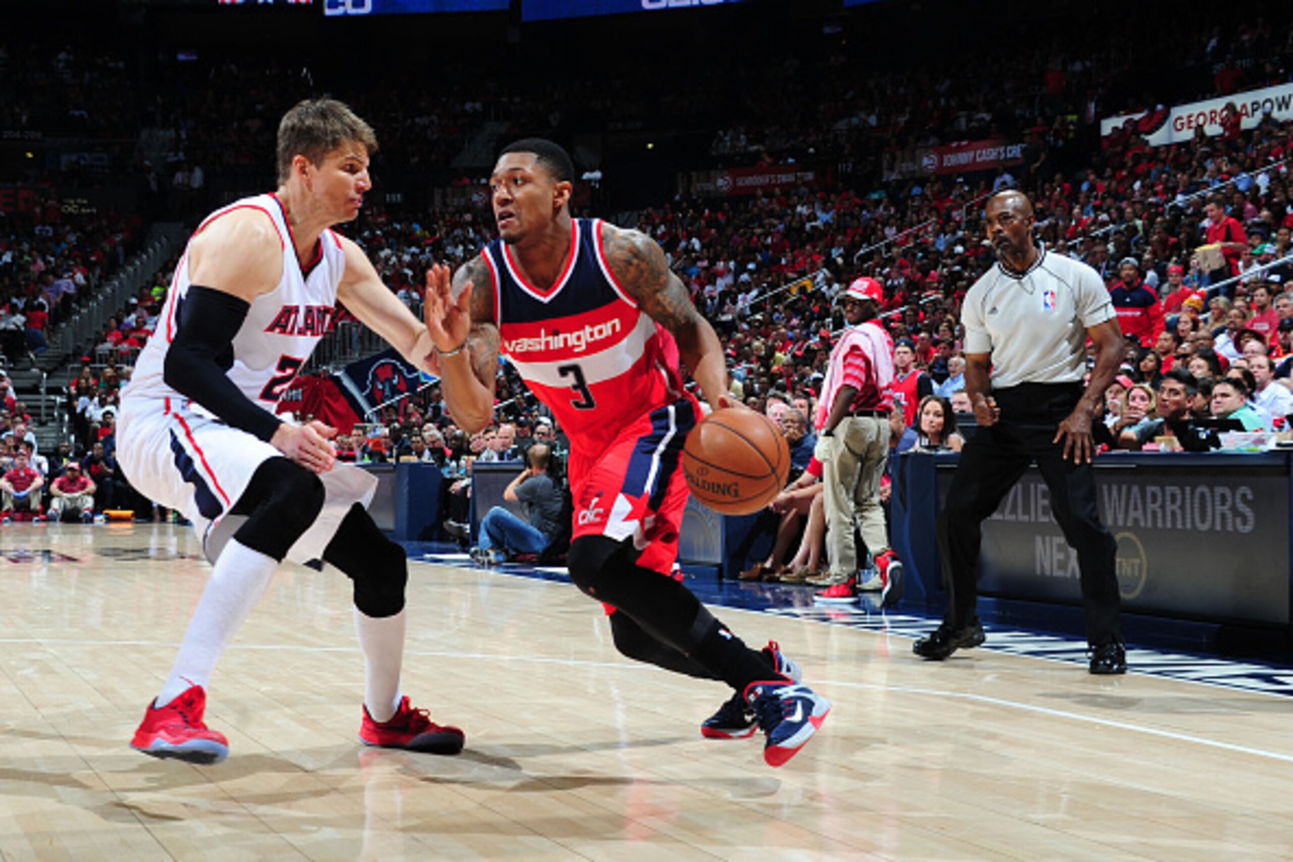 ATLANTA, GA - MAY 13: Bradley Beal #3 of the Washington Wizards drives to the basket against Kyle Korver #26 of the Atlanta Hawks in Game Five of the Eastern Conference Semifinals during the 2015 NBA Playoffs on May 13, 2015 at the Philips Arena in Atlan ATLANTA, GA - MAY 13: Bradley Beal #3 of the Washington Wizards drives to the basket against Kyle Korver #26 of the Atlanta Hawks in Game Five of the Eastern Conference Semifinals during the 2015 NBA Playoffs on May 13, 2015 at the Philips Arena in Atlan