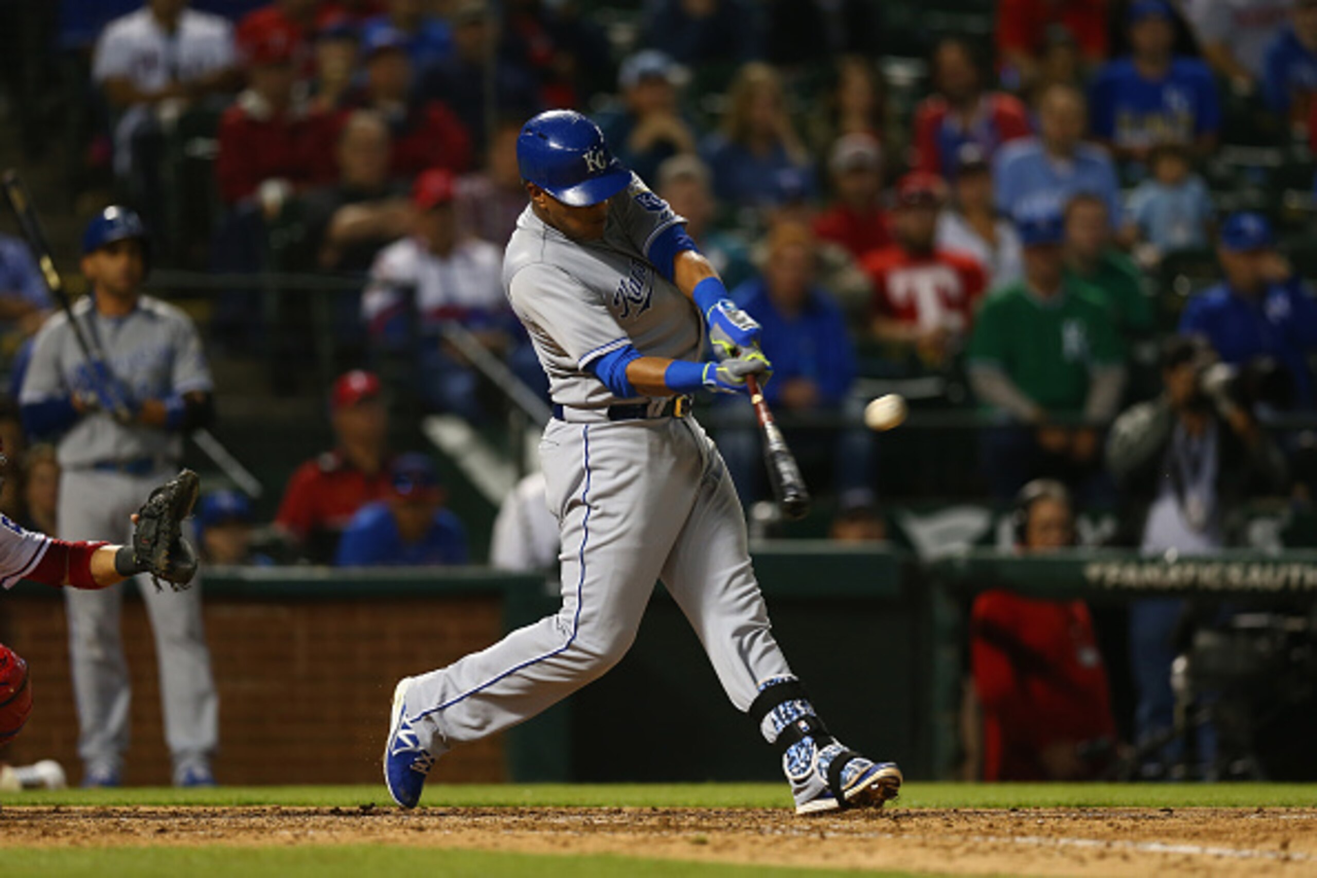 ARLINGTON, TX - MAY 13:  Salvador Perez #13 of the Kansas City Royals hits a rbi double in the seventh inning against the Texas Rangers at Globe Life Park in Arlington on May 13, 2015 in Arlington, Texas.  (Photo by Ronald Martinez/Getty Images)