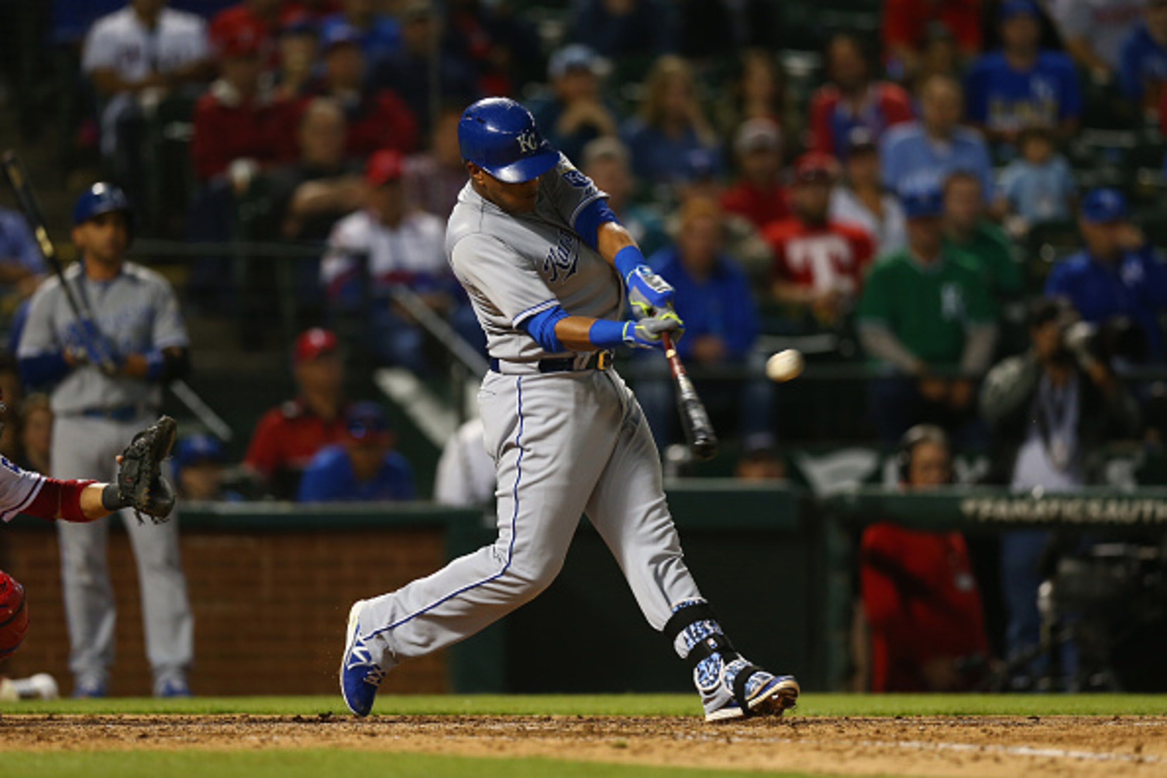 ARLINGTON, TX - MAY 13:  Salvador Perez #13 of the Kansas City Royals hits a rbi double in the seventh inning against the Texas Rangers at Globe Life Park in Arlington on May 13, 2015 in Arlington, Texas.  (Photo by Ronald Martinez/Getty Images)