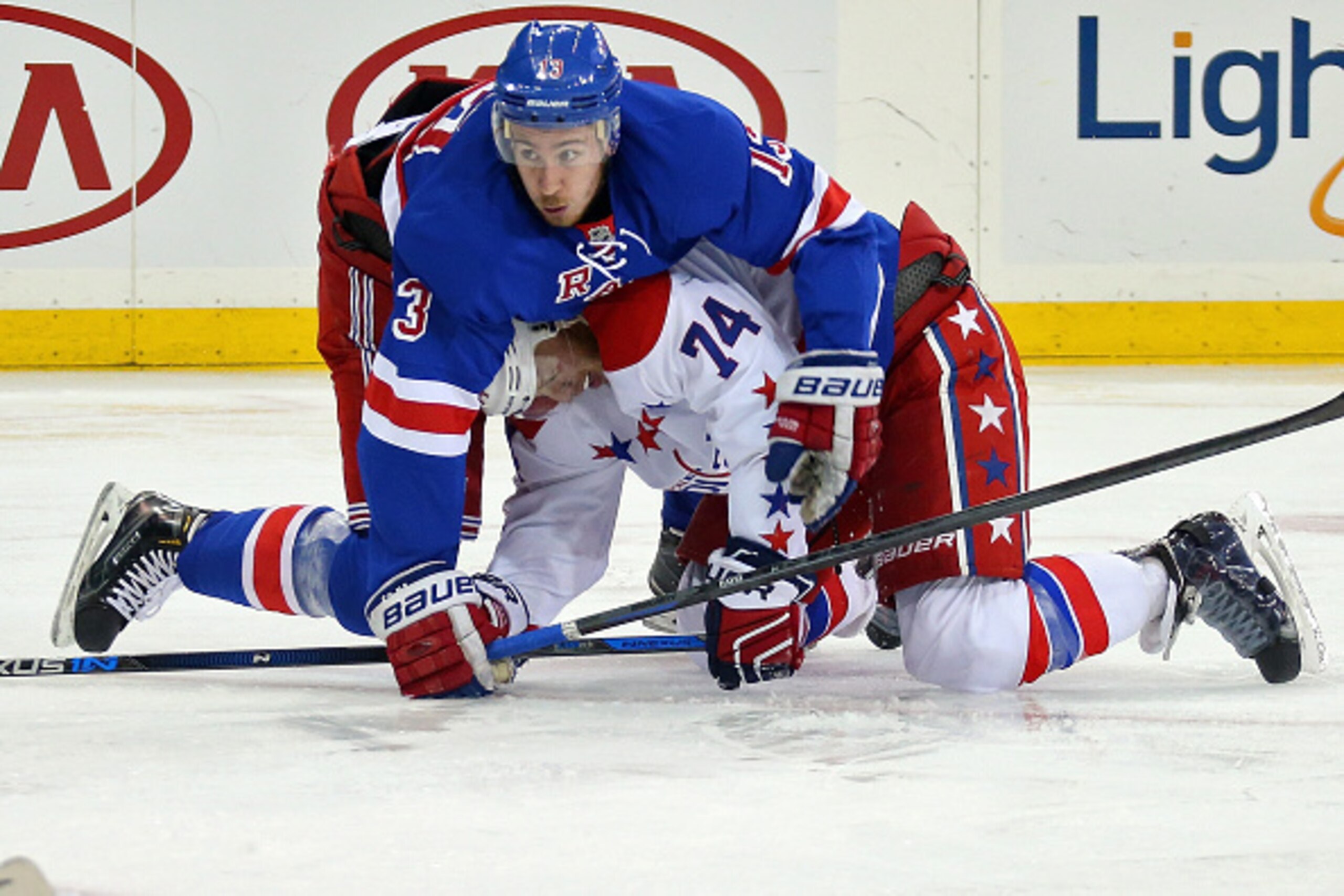 NEW YORK, NY - MAY 13:  Kevin Hayes #13 of the New York Rangers gets tangled up with John Carlson #74 of the Washington Capitals in Game Seven of the Eastern Conference Semifinals during the 2015 NHL Stanley Cup Playoffs at Madison Square Garden on May 13