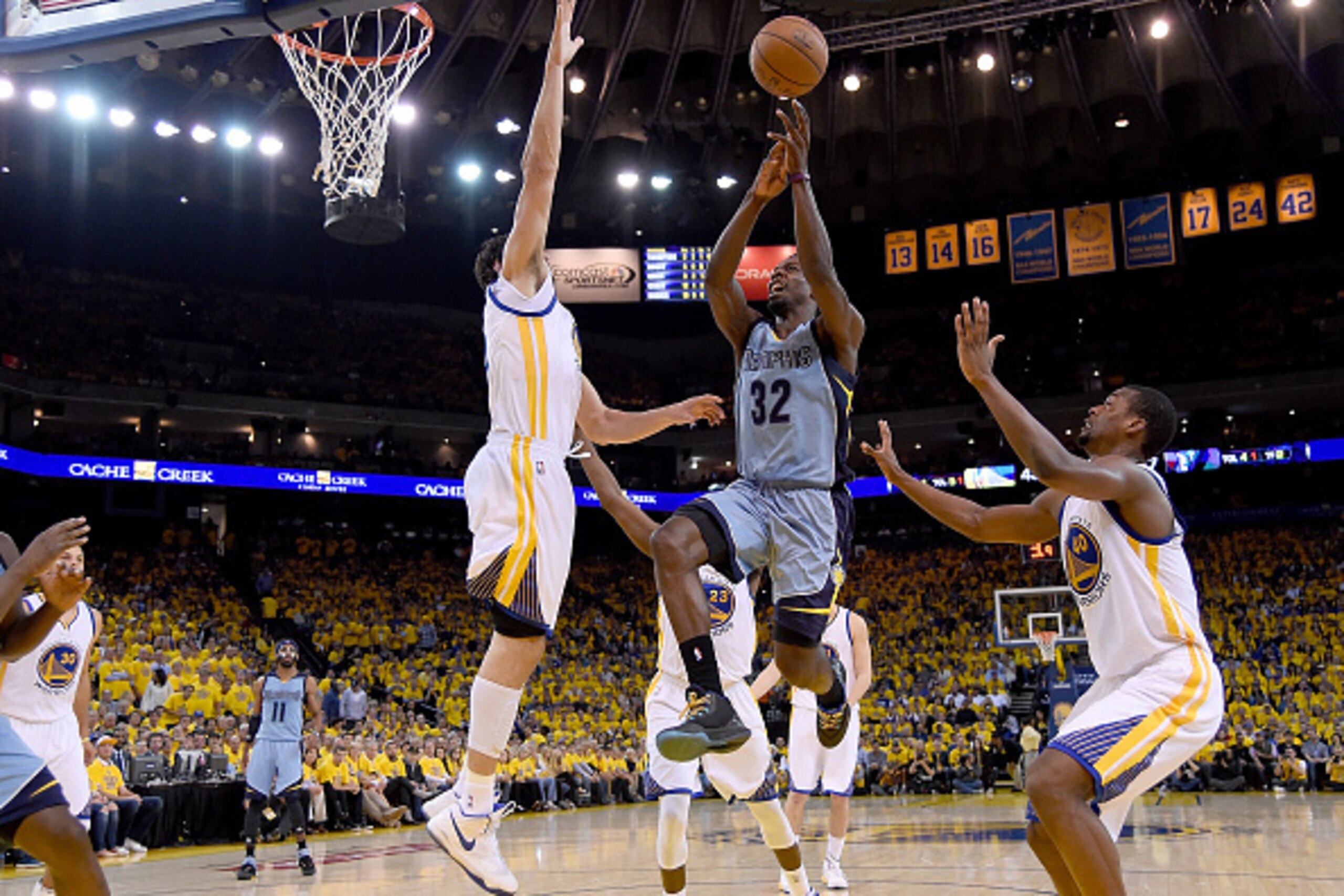 OAKLAND, CA - MAY 13:  Jeff Green #32 of the Memphis Grizzlies goes up to shoot over  Andrew Bogut #12 of the Golden State Warriors but loses control of the ball out of bounds in the second quarter during Game Five of the Western Conference Semifinals of 