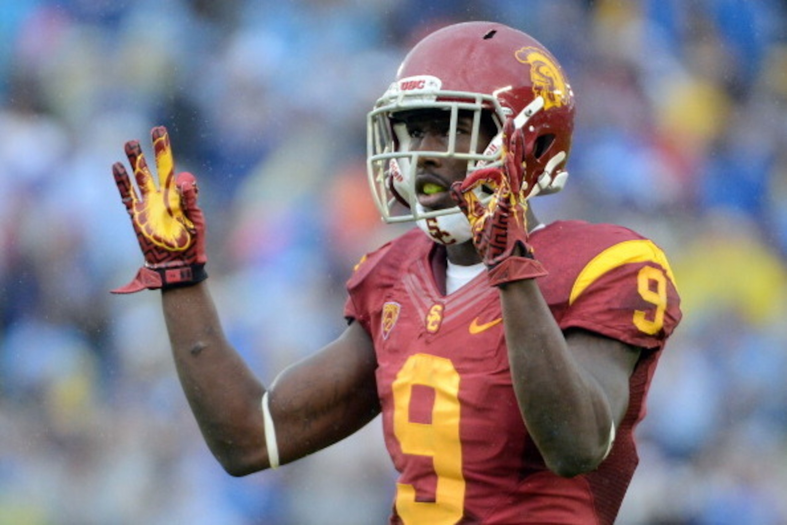 PASADENA, CA - NOVEMBER 17:  Marqise Lee #9 of the USC Trojans reacts to the crowd during a 38-28 loss to the UCLA Bruins at Rose Bowl on November 17, 2012 in Pasadena, California.  (Photo by Harry How/Getty Images)