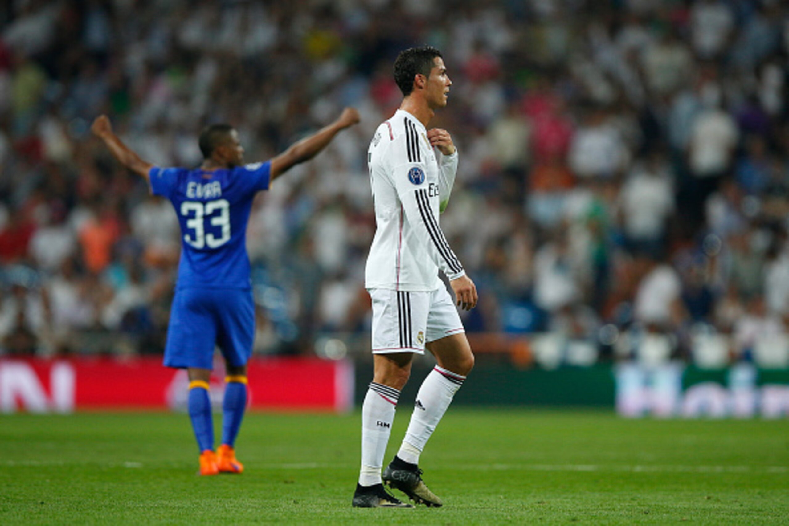 MADRID, SPAIN - MAY 13:  A dejected Cristiano Ronaldo of Real Madrid walks off the pitch following his team's exit from the competition during the UEFA Champions League Semi Final, second leg match between Real Madrid and Juventus at Estadio Santiago Bern