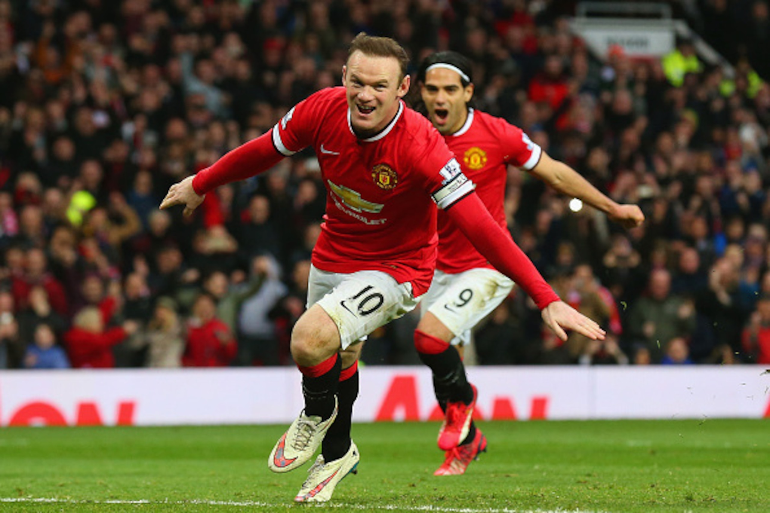 MANCHESTER, ENGLAND - FEBRUARY 28:  Wayne Rooney of Manchester United celebrates scoring the opening goal with Radamel Falcao García of Manchester United  during the Barclays Premier League match between Manchester United and Sunderland at Old Trafford on