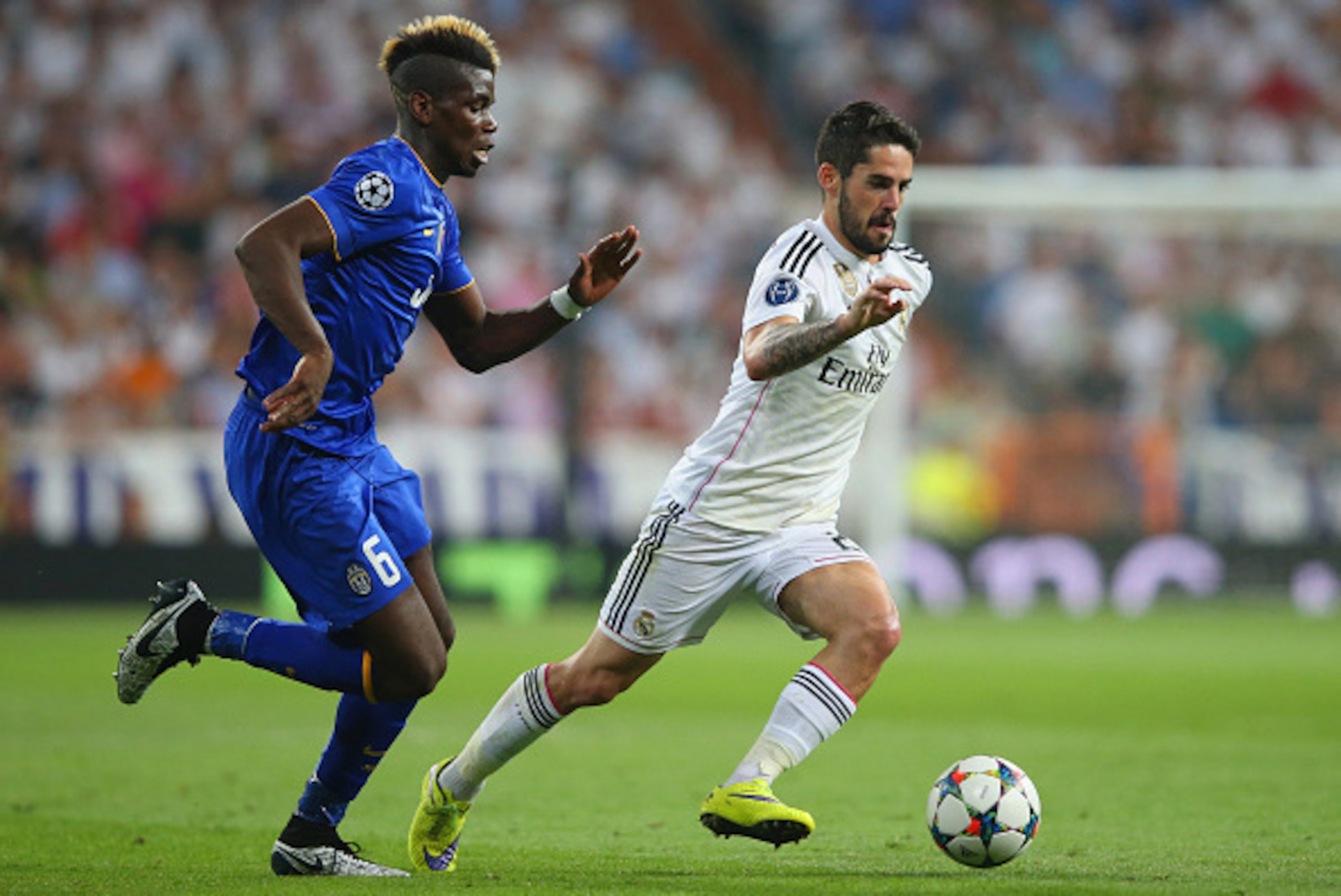 MADRID, SPAIN - MAY 13: Isco of Real Madrid is pursued by Paul Pogba of Juventus during the UEFA Champions League Semi Final, second leg match between Real Madrid and Juventus at Estadio Santiago Bernabeu on May 13, 2015 in Madrid, Spain. (Photo by Alex MADRID, SPAIN - MAY 13: Isco of Real Madrid is pursued by Paul Pogba of Juventus during the UEFA Champions League Semi Final, second leg match between Real Madrid and Juventus at Estadio Santiago Bernabeu on May 13, 2015 in Madrid, Spain. (Photo by Alex