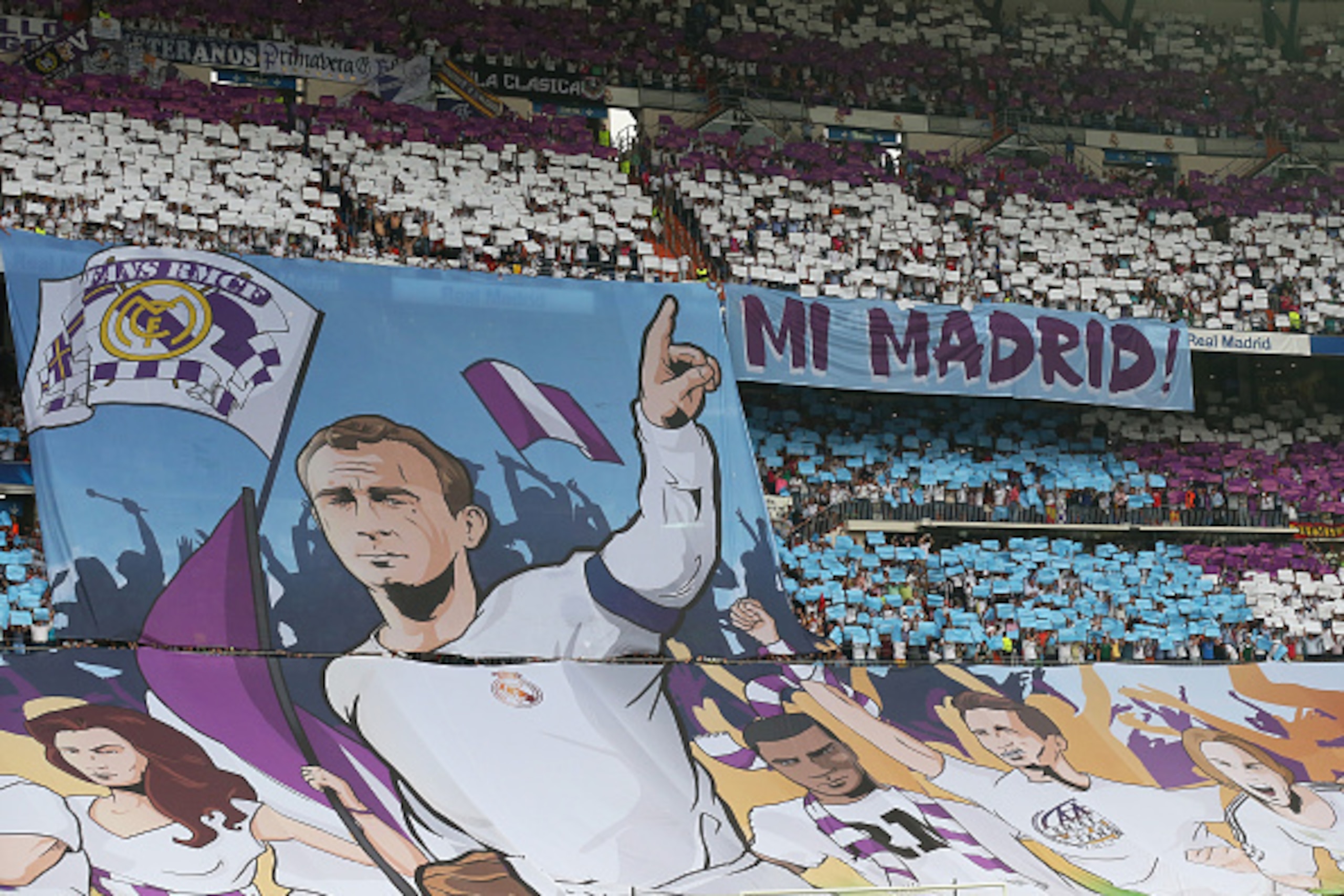 MADRID, SPAIN - MAY 13:  Real Madrid fans hold up banners prior to kickoff during the UEFA Champions League Semi Final, second leg match between Real Madrid and Juventus at Estadio Santiago Bernabeu on May 13, 2015 in Madrid, Spain.  (Photo by Alex Livese