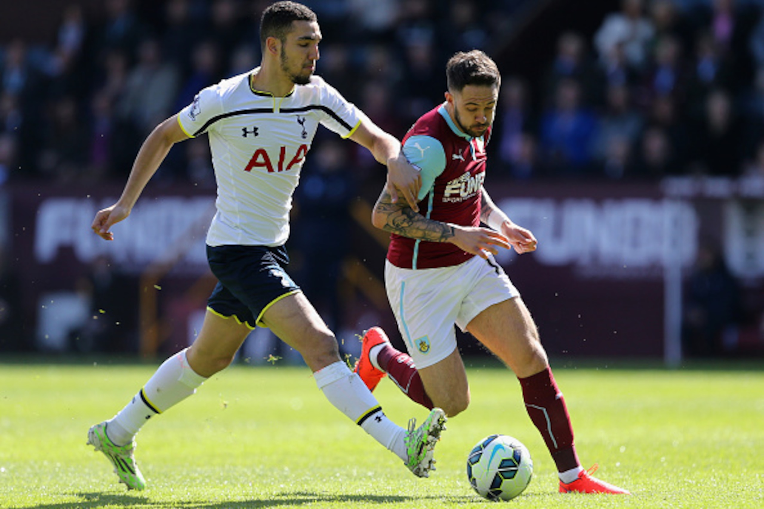 BURNLEY, ENGLAND - APRIL 05: Danny Ings of Burnley holds off a challenge from Nabil Bentaleb of Spurs during the Barclays Premier League match between Burnley and Tottenham Hotspur at Turf Moor on April 5, 2015 in Burnley, England. (Photo by Jan Kruger/ BURNLEY, ENGLAND - APRIL 05: Danny Ings of Burnley holds off a challenge from Nabil Bentaleb of Spurs during the Barclays Premier League match between Burnley and Tottenham Hotspur at Turf Moor on April 5, 2015 in Burnley, England. (Photo by Jan Kruger/